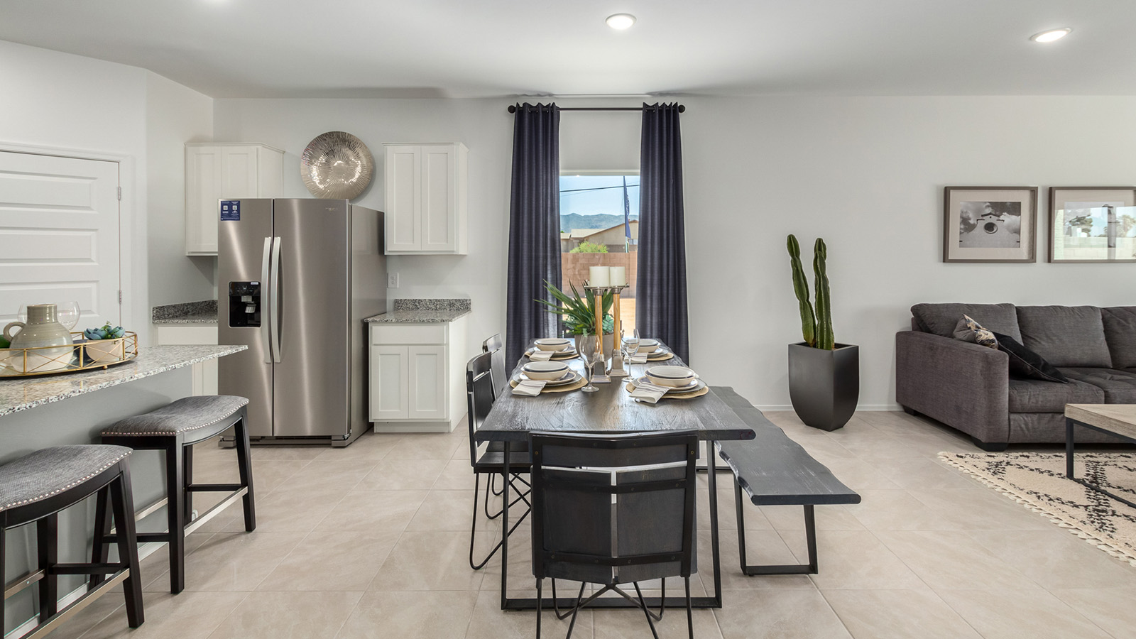 Welcome to The Gaven at Casas del Cerrito in Tucson, Arizona – a spacious 1,815 sq. ft. single-story new home that combines modern living with the beauty of the surrounding desert landscape.  As you step through the welcoming front porch, the entryway guides you into a generous great room. This open and inviting space is perfect for gatherings, effortlessly flowing into the dining area and kitchen, making it ideal for both daily living and entertaining.  The kitchen serves as the centerpiece of the home, boasting polished quartz countertops, a sizable island with a breakfast bar, modern appliances, and a pantry that provides ample storage for all your culinary needs. The layout ensures that the kitchen, dining area, and great room are interconnected, fostering a sense of togetherness.  Step outside to the covered patio, where you can take in the views and stunning finished backyard and enjoy Tucson’s warm climate. Whether you’re planning an outdoor meal or simply enjoying the fresh air, this space extends your living area and enhances your outdoor experience.  At the rear of the home, you'll find the primary suite – your private sanctuary. The primary bedroom offers a spacious setting, complemented by a large walk-in closet and an en-suite bathroom featuring dual vanities and a walk-in shower, creating a space where comfort meets practicality.  The Gaven also includes three additional bedrooms, each designed with plenty of space and natural light. These rooms are conveniently located near a second full bathroom, making it easy to accommodate family members and guests.  To enhance everyday living, the home includes a utility room and direct access to a two-car garage, designed to make household tasks more manageable.  Designed with energy efficiency in mind, The Gaven at Casas del Cerrito is a DOE Zero Energy Ready Home, offering sustainability, comfort, and long-term savings.  *Images shown are for reference only. They depict the Gaven Model home and may not represent the actual home.