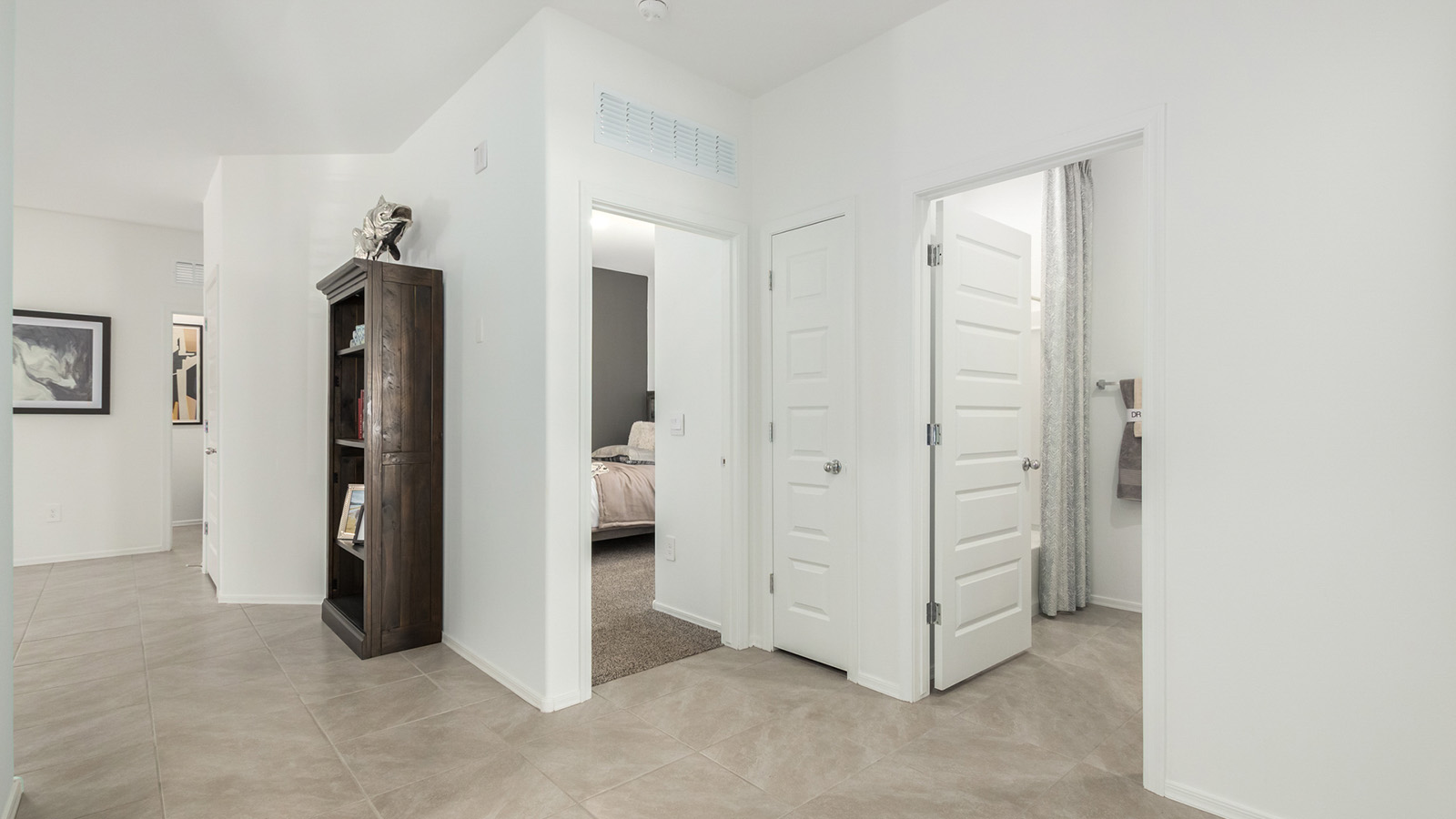 Welcome to The Gaven at Casas del Cerrito in Tucson, Arizona – a spacious 1,815 sq. ft. single-story new home that combines modern living with the beauty of the surrounding desert landscape.  As you step through the welcoming front porch, the entryway guides you into a generous great room. This open and inviting space is perfect for gatherings, effortlessly flowing into the dining area and kitchen, making it ideal for both daily living and entertaining.  The kitchen serves as the centerpiece of the home, boasting polished quartz countertops, a sizable island with a breakfast bar, modern appliances, and a pantry that provides ample storage for all your culinary needs. The layout ensures that the kitchen, dining area, and great room are interconnected, fostering a sense of togetherness.  Step outside to the covered patio, where you can take in the views and stunning finished backyard and enjoy Tucson’s warm climate. Whether you’re planning an outdoor meal or simply enjoying the fresh air, this space extends your living area and enhances your outdoor experience.  At the rear of the home, you'll find the primary suite – your private sanctuary. The primary bedroom offers a spacious setting, complemented by a large walk-in closet and an en-suite bathroom featuring dual vanities and a walk-in shower, creating a space where comfort meets practicality.  The Gaven also includes three additional bedrooms, each designed with plenty of space and natural light. These rooms are conveniently located near a second full bathroom, making it easy to accommodate family members and guests.  To enhance everyday living, the home includes a utility room and direct access to a two-car garage, designed to make household tasks more manageable.  Designed with energy efficiency in mind, The Gaven at Casas del Cerrito is a DOE Zero Energy Ready Home, offering sustainability, comfort, and long-term savings.  *Images shown are for reference only. They depict the Gaven Model home and may not represent the actual home.