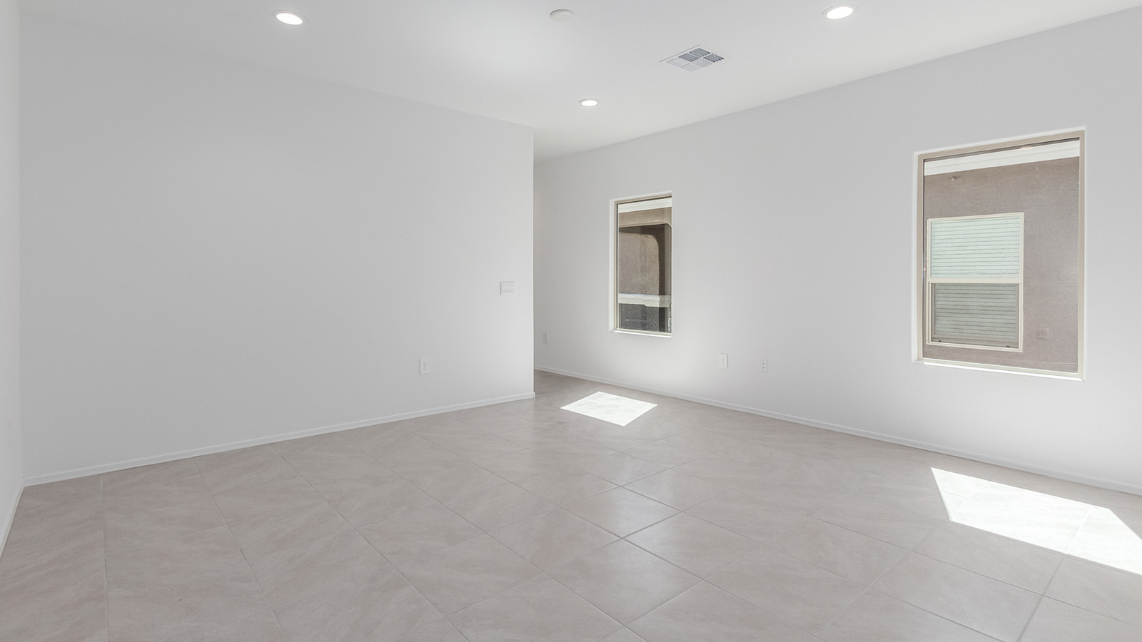 Discover The Diana, a well-planned single-story new home in the vibrant Senita Crossing community. Spanning 1,558 square feet, this residence offers three bedrooms and two bathrooms, all within a layout that emphasizes comfort and ease of living.  As you enter through the front porch, you're greeted by a welcoming foyer that opens into the sprawling great room. This space, designed to be the heart of the home, flows effortlessly into the dining area and kitchen, making it ideal for both everyday living and entertaining. The kitchen is outfitted with a large island, granite countertops, and stylish Shaker-style cabinetry, combining practicality with a touch of sophistication. A generous pantry ensures that storage is never an issue, and stainless steel appliances, including a gas range, microwave, and dishwasher, are all standard, enhancing your cooking experience.  The primary bedroom is thoughtfully located at the rear of the home, providing a private retreat complete with a spacious walk-in closet and an en-suite bathroom featuring dual vanities. The additional two bedrooms are positioned at the opposite end of the home, each with easy access to the second bathroom, making this layout perfect for families or guests.  Outdoor living is a key feature of The Diana, with a covered patio that extends your living space to the outside. Whether you’re enjoying a quiet morning coffee or hosting an evening gathering, this space is perfect for taking advantage of Tucson’s beautiful weather.  Senita Crossing is a community that blends convenience with comfort. Located on Tucson’s southeast side, residents enjoy easy access to I-10, Davis-Monthan Air Force Base, and major employers like Raytheon, making it an ideal location for both families and professionals. Inside The Diana, modern conveniences like 12”x12” ceramic tile flooring, granite countertops, and stainless steel appliances are standard, ensuring that your home is as functional as it is beautiful.  Energy efficiency is a priority in The Diana, with features like a tankless water heater, LED lighting, and advanced spray foam insulation, all contributing to lower energy costs and a smaller carbon footprint. The home is also equipped with D.R. Horton’s Home is Connected® Smart Home package, which includes a smart thermostat, video doorbell, keyless entry, and more, providing both convenience and peace of mind.  Living in Senita Crossing means access to top-rated schools in the Sunnyside Unified School District, as well as proximity to outdoor destinations like Sabino Canyon and cultural attractions like the Tucson Botanical Gardens. The community offers amenities such as a park, playground, and maintained walking and biking trails, making it a perfect place for families to thrive.  The Diana at Senita Crossing is more than just a home; it’s a place where comfort, convenience, and modern living come together to create the perfect environment for you and your family.