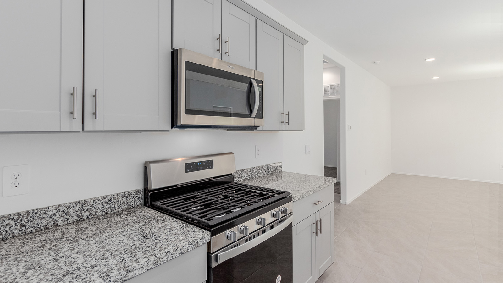 Discover The Diana, a well-planned single-story new home in the vibrant Senita Crossing community. Spanning 1,558 square feet, this residence offers three bedrooms and two bathrooms, all within a layout that emphasizes comfort and ease of living.  As you enter through the front porch, you're greeted by a welcoming foyer that opens into the sprawling great room. This space, designed to be the heart of the home, flows effortlessly into the dining area and kitchen, making it ideal for both everyday living and entertaining. The kitchen is outfitted with a large island, granite countertops, and stylish Shaker-style cabinetry, combining practicality with a touch of sophistication. A generous pantry ensures that storage is never an issue, and stainless steel appliances, including a gas range, microwave, and dishwasher, are all standard, enhancing your cooking experience.  The primary bedroom is thoughtfully located at the rear of the home, providing a private retreat complete with a spacious walk-in closet and an en-suite bathroom featuring dual vanities. The additional two bedrooms are positioned at the opposite end of the home, each with easy access to the second bathroom, making this layout perfect for families or guests.  Outdoor living is a key feature of The Diana, with a covered patio that extends your living space to the outside. Whether you’re enjoying a quiet morning coffee or hosting an evening gathering, this space is perfect for taking advantage of Tucson’s beautiful weather.  Senita Crossing is a community that blends convenience with comfort. Located on Tucson’s southeast side, residents enjoy easy access to I-10, Davis-Monthan Air Force Base, and major employers like Raytheon, making it an ideal location for both families and professionals. Inside The Diana, modern conveniences like 12”x12” ceramic tile flooring, granite countertops, and stainless steel appliances are standard, ensuring that your home is as functional as it is beautiful.  Energy efficiency is a priority in The Diana, with features like a tankless water heater, LED lighting, and advanced spray foam insulation, all contributing to lower energy costs and a smaller carbon footprint. The home is also equipped with D.R. Horton’s Home is Connected® Smart Home package, which includes a smart thermostat, video doorbell, keyless entry, and more, providing both convenience and peace of mind.  Living in Senita Crossing means access to top-rated schools in the Sunnyside Unified School District, as well as proximity to outdoor destinations like Sabino Canyon and cultural attractions like the Tucson Botanical Gardens. The community offers amenities such as a park, playground, and maintained walking and biking trails, making it a perfect place for families to thrive.  The Diana at Senita Crossing is more than just a home; it’s a place where comfort, convenience, and modern living come together to create the perfect environment for you and your family.