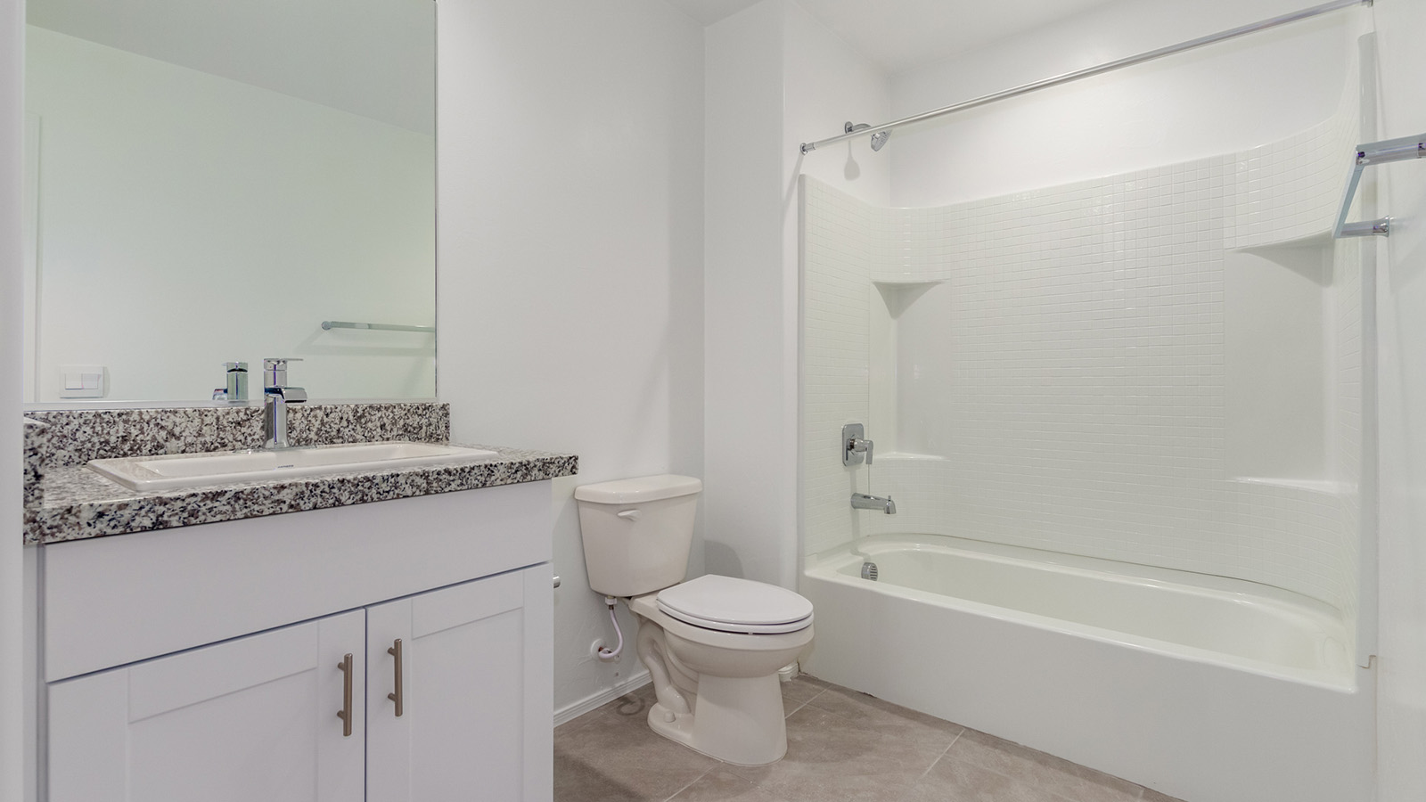 Step into The Grace, a charming two-story new home in the welcoming Senita Crossing community, designed for modern living with a blend of style and practicality. With 1,963 square feet, this home offers four bedrooms, two and a half bathrooms, and ample space for both family life and entertaining.  As you walk through the front porch and enter the home, you're greeted by a welcoming entryway that leads directly into the spacious great room. This central gathering space effortlessly connects to the dining area and kitchen, creating an inviting atmosphere for both daily activities and special occasions. The kitchen is equipped with granite countertops, a central island, and stylish Shaker cabinetry, making it as functional as it is aesthetically pleasing. A walk-in pantry provides additional storage, ensuring your kitchen remains organized and ready for any culinary adventure.  Upstairs, you’ll find all four bedrooms, each designed to offer comfort and privacy. The primary bedroom features a generous walk-in closet and an en-suite bathroom with dual sinks and a spacious shower, providing a serene space to unwind at the end of the day. The remaining three bedrooms share a full bathroom and are conveniently located near the laundry room, making household tasks more efficient.  The outdoor living space at The Grace is equally impressive. The covered patio offers a perfect spot to enjoy Tucson’s beautiful weather, whether you’re hosting a barbecue or simply relaxing outdoors.  Living in Senita Crossing means you’re part of a community that values both convenience and quality. Located on Tucson’s southeast side, this neighborhood offers easy access to I-10, making commutes to major employers like Raytheon and Davis-Monthan Air Force Base quick and easy. The University of Arizona is also within reach, making this an ideal location for both families and professionals.  Inside The Grace, you’ll find modern conveniences like 12”x12” ceramic tile flooring throughout most areas, granite countertops, and stainless steel appliances, including a gas range, microwave, and dishwasher. The Home is Connected® Smart Home package ensures that your home is as technologically advanced as it is comfortable, with features like a smart thermostat, video doorbell, keyless entry and more.  Energy efficiency is a priority at Senita Crossing, with homes designed to meet DOE Zero Energy Ready standards. Features like tankless water heaters, LED lighting, and advanced spray foam insulation contribute to lower energy costs and a reduced carbon footprint, making The Grace a sustainable and cost-effective living choice.  Senita Crossing also offers a range of family-friendly amenities, including a park with a playground, a ramada, and a grassy common area. The community’s maintained bike and walking trail connects to McCain Loop, providing plenty of opportunities for outdoor recreation.