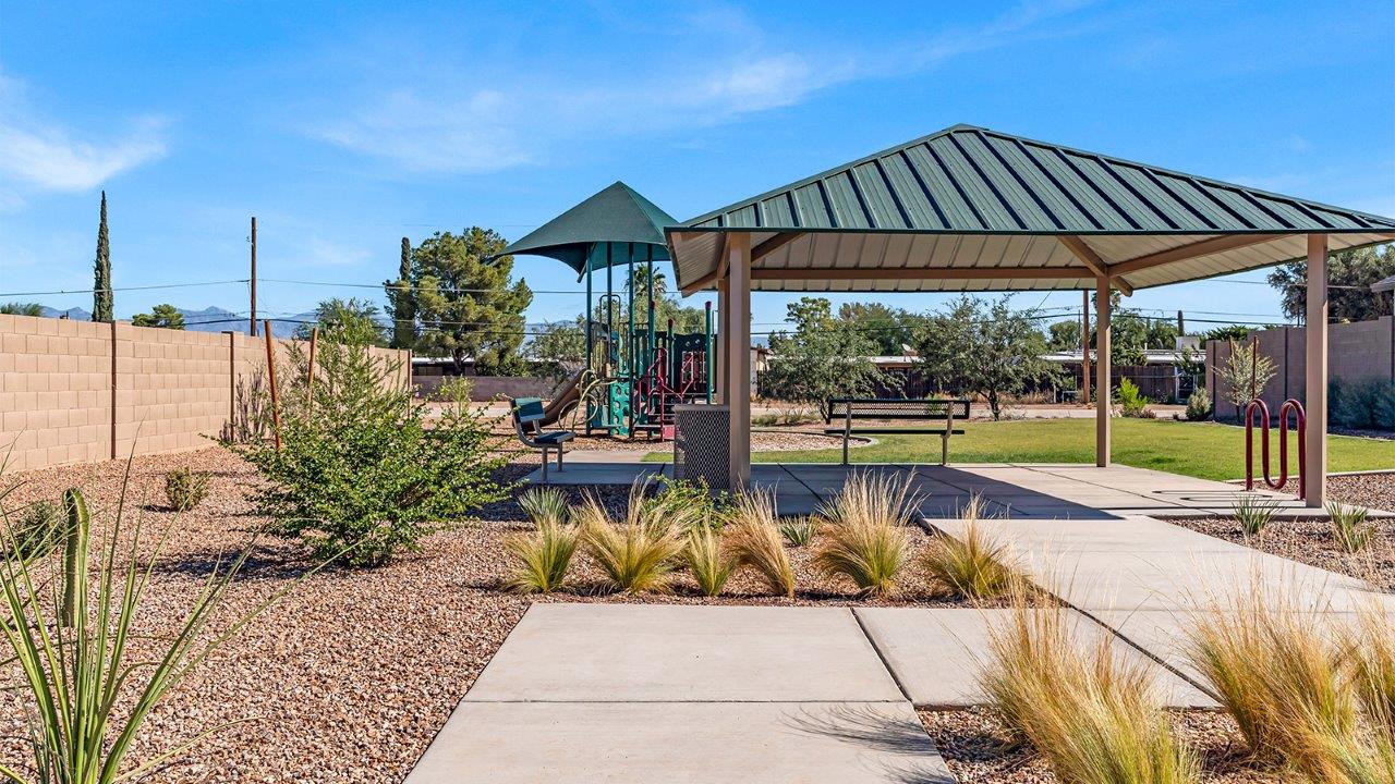 Step into The Gaven, a thoughtfully designed single-story new home nestled within the inviting Senita Crossing community. With 1,776 square feet of living space, this home offers four bedrooms and two bathrooms, ideal for those seeking a blend of functionality and modern style.  As you enter through the front porch, the foyer opens up to reveal a spacious and open layout that flows seamlessly from the entryway to the living areas. The great room serves as the heart of the home, connecting effortlessly to the dining area and kitchen, making it a perfect space for both relaxation and entertaining. The kitchen is a chef's delight, featuring a central island, granite countertops, and Shaker-style cabinetry, providing ample storage and a sleek, modern aesthetic. A large pantry adds to the kitchen’s practicality, ensuring all your culinary essentials are close at hand.  The primary bedroom is strategically placed at the rear of the home, offering a private and serene space complete with a walk-in closet and an en-suite bathroom featuring dual vanities and a spacious shower. The additional three bedrooms are situated toward the front of the home, sharing a full bathroom, making this layout ideal for families or hosting guests.  One of the highlights of The Gaven is its outdoor living space. The covered patio extends from the great room, offering an ideal spot to enjoy Tucson’s beautiful weather. Whether you’re hosting a barbecue, enjoying a quiet morning coffee, or simply relaxing outdoors, this space is designed to enhance your living experience.  Located in the thriving Senita Crossing community on Tucson’s southeast side, residents of The Gaven enjoy a variety of amenities designed for modern living. The community offers easy access to I-10, making commuting a breeze, and is conveniently situated near Davis-Monthan Air Force Base, Raytheon, and the University of Arizona, making it an ideal location for both families and professionals.   Inside The Gaven, you’ll find modern conveniences like 12”x12” ceramic tile flooring, granite countertops, and stainless steel appliances, including a gas range, microwave, and dishwasher. The Home is Connected® Smart Home package, featuring a smart thermostat, video doorbell, and keyless entry, ensures that your home is as functional as it is stylish.  Energy efficiency is a priority at Senita Crossing, with homes that meet DOE Zero Energy Ready standards. Features like tankless water heaters, LED lighting, and advanced spray foam insulation contribute to lower energy costs and a smaller carbon footprint, offering you a sustainable and cost-effective living environment.  Senita Crossing also boasts family-friendly amenities, including a park with a playground, a ramada, and a grassy common area, as well as a maintained bike and walking trail that connects to McCain Loop. The community is served by the highly regarded Sunnyside Unified School District, offering access to top-rated schools, ensuring a bright future for the young ones.  The Gaven at Senita Crossing is more than just a home—it’s a place where comfort, style, and modern living come together to create the perfect environment for you and your family.