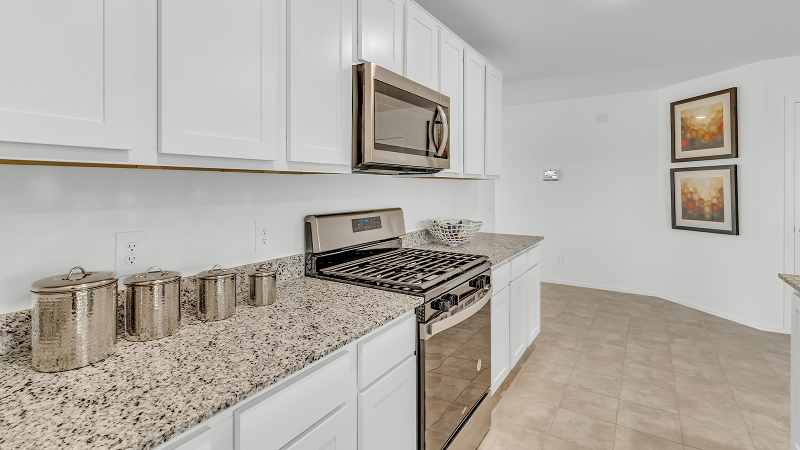 Step into The Gaven, a thoughtfully designed single-story new home nestled within the inviting Senita Crossing community. With 1,776 square feet of living space, this home offers four bedrooms and two bathrooms, ideal for those seeking a blend of functionality and modern style.  As you enter through the front porch, the foyer opens up to reveal a spacious and open layout that flows seamlessly from the entryway to the living areas. The great room serves as the heart of the home, connecting effortlessly to the dining area and kitchen, making it a perfect space for both relaxation and entertaining. The kitchen is a chef's delight, featuring a central island, granite countertops, and Shaker-style cabinetry, providing ample storage and a sleek, modern aesthetic. A large pantry adds to the kitchen’s practicality, ensuring all your culinary essentials are close at hand.  The primary bedroom is strategically placed at the rear of the home, offering a private and serene space complete with a walk-in closet and an en-suite bathroom featuring dual vanities and a spacious shower. The additional three bedrooms are situated toward the front of the home, sharing a full bathroom, making this layout ideal for families or hosting guests.  One of the highlights of The Gaven is its outdoor living space. The covered patio extends from the great room, offering an ideal spot to enjoy Tucson’s beautiful weather. Whether you’re hosting a barbecue, enjoying a quiet morning coffee, or simply relaxing outdoors, this space is designed to enhance your living experience.  Located in the thriving Senita Crossing community on Tucson’s southeast side, residents of The Gaven enjoy a variety of amenities designed for modern living. The community offers easy access to I-10, making commuting a breeze, and is conveniently situated near Davis-Monthan Air Force Base, Raytheon, and the University of Arizona, making it an ideal location for both families and professionals.   Inside The Gaven, you’ll find modern conveniences like 12”x12” ceramic tile flooring, granite countertops, and stainless steel appliances, including a gas range, microwave, and dishwasher. The Home is Connected® Smart Home package, featuring a smart thermostat, video doorbell, and keyless entry, ensures that your home is as functional as it is stylish.  Energy efficiency is a priority at Senita Crossing, with homes that meet DOE Zero Energy Ready standards. Features like tankless water heaters, LED lighting, and advanced spray foam insulation contribute to lower energy costs and a smaller carbon footprint, offering you a sustainable and cost-effective living environment.  Senita Crossing also boasts family-friendly amenities, including a park with a playground, a ramada, and a grassy common area, as well as a maintained bike and walking trail that connects to McCain Loop. The community is served by the highly regarded Sunnyside Unified School District, offering access to top-rated schools, ensuring a bright future for the young ones.  The Gaven at Senita Crossing is more than just a home—it’s a place where comfort, style, and modern living come together to create the perfect environment for you and your family.