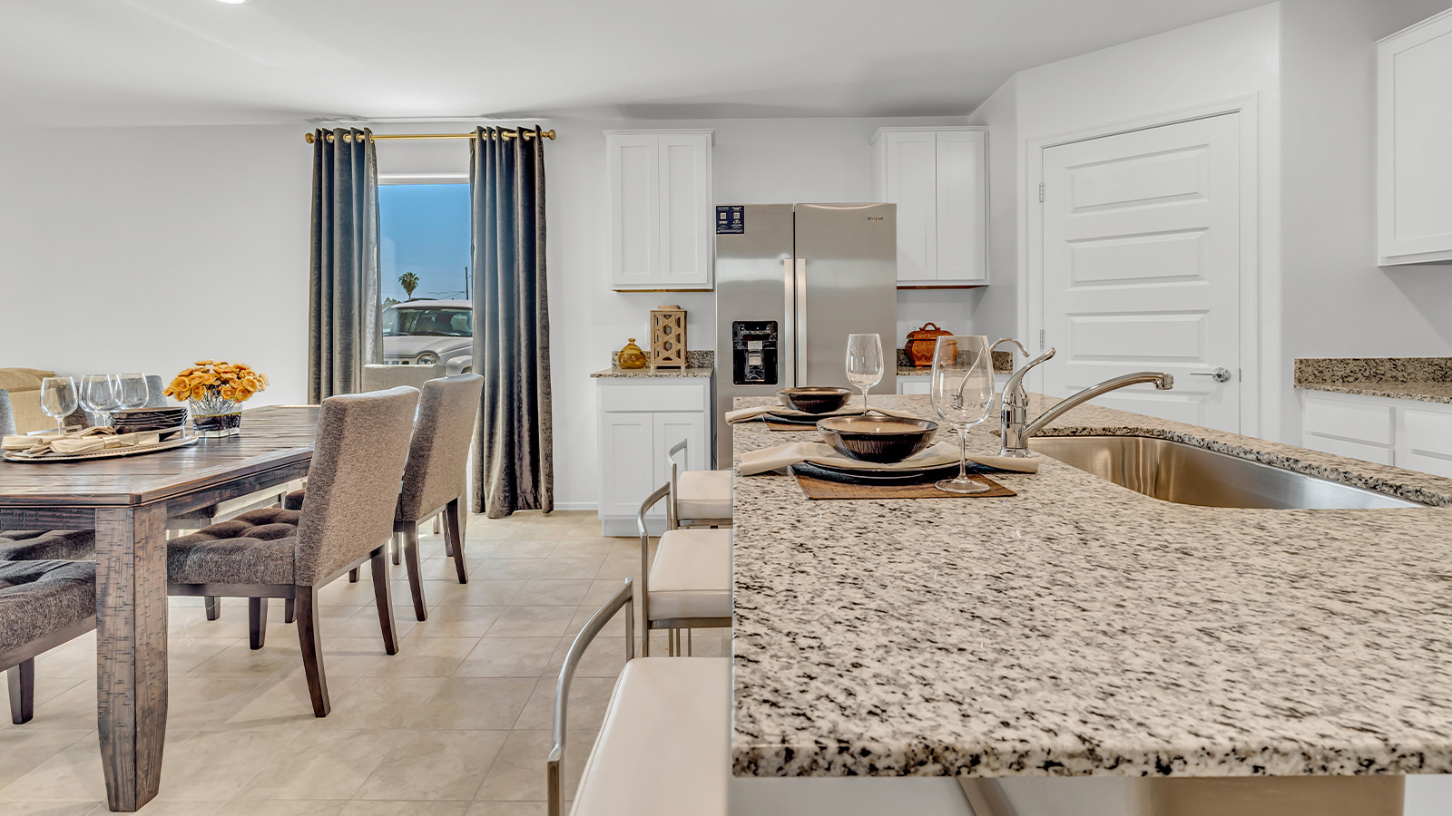 Step into The Gaven, a thoughtfully designed single-story new home nestled within the inviting Senita Crossing community. With 1,776 square feet of living space, this home offers four bedrooms and two bathrooms, ideal for those seeking a blend of functionality and modern style.  As you enter through the front porch, the foyer opens up to reveal a spacious and open layout that flows seamlessly from the entryway to the living areas. The great room serves as the heart of the home, connecting effortlessly to the dining area and kitchen, making it a perfect space for both relaxation and entertaining. The kitchen is a chef's delight, featuring a central island, granite countertops, and Shaker-style cabinetry, providing ample storage and a sleek, modern aesthetic. A large pantry adds to the kitchen’s practicality, ensuring all your culinary essentials are close at hand.  The primary bedroom is strategically placed at the rear of the home, offering a private and serene space complete with a walk-in closet and an en-suite bathroom featuring dual vanities and a spacious shower. The additional three bedrooms are situated toward the front of the home, sharing a full bathroom, making this layout ideal for families or hosting guests.  One of the highlights of The Gaven is its outdoor living space. The covered patio extends from the great room, offering an ideal spot to enjoy Tucson’s beautiful weather. Whether you’re hosting a barbecue, enjoying a quiet morning coffee, or simply relaxing outdoors, this space is designed to enhance your living experience.  Located in the thriving Senita Crossing community on Tucson’s southeast side, residents of The Gaven enjoy a variety of amenities designed for modern living. The community offers easy access to I-10, making commuting a breeze, and is conveniently situated near Davis-Monthan Air Force Base, Raytheon, and the University of Arizona, making it an ideal location for both families and professionals.   Inside The Gaven, you’ll find modern conveniences like 12”x12” ceramic tile flooring, granite countertops, and stainless steel appliances, including a gas range, microwave, and dishwasher. The Home is Connected® Smart Home package, featuring a smart thermostat, video doorbell, and keyless entry, ensures that your home is as functional as it is stylish.  Energy efficiency is a priority at Senita Crossing, with homes that meet DOE Zero Energy Ready standards. Features like tankless water heaters, LED lighting, and advanced spray foam insulation contribute to lower energy costs and a smaller carbon footprint, offering you a sustainable and cost-effective living environment.  Senita Crossing also boasts family-friendly amenities, including a park with a playground, a ramada, and a grassy common area, as well as a maintained bike and walking trail that connects to McCain Loop. The community is served by the highly regarded Sunnyside Unified School District, offering access to top-rated schools, ensuring a bright future for the young ones.  The Gaven at Senita Crossing is more than just a home—it’s a place where comfort, style, and modern living come together to create the perfect environment for you and your family.