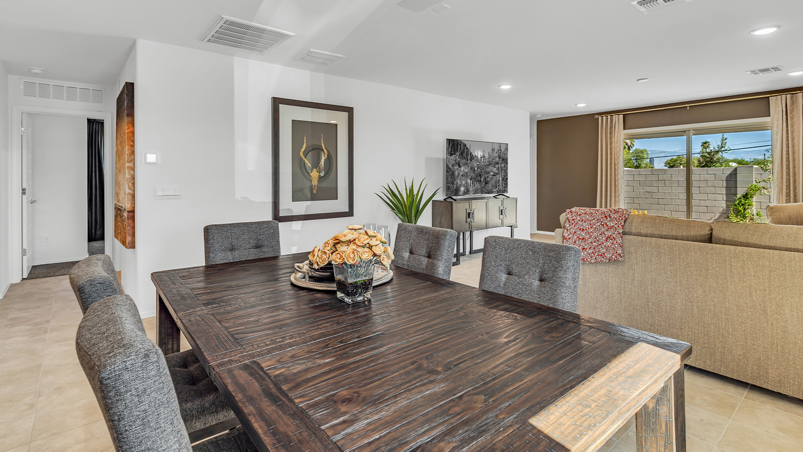 Step into The Gaven, a thoughtfully designed single-story new home nestled within the inviting Senita Crossing community. With 1,776 square feet of living space, this home offers four bedrooms and two bathrooms, ideal for those seeking a blend of functionality and modern style.  As you enter through the front porch, the foyer opens up to reveal a spacious and open layout that flows seamlessly from the entryway to the living areas. The great room serves as the heart of the home, connecting effortlessly to the dining area and kitchen, making it a perfect space for both relaxation and entertaining. The kitchen is a chef's delight, featuring a central island, granite countertops, and Shaker-style cabinetry, providing ample storage and a sleek, modern aesthetic. A large pantry adds to the kitchen’s practicality, ensuring all your culinary essentials are close at hand.  The primary bedroom is strategically placed at the rear of the home, offering a private and serene space complete with a walk-in closet and an en-suite bathroom featuring dual vanities and a spacious shower. The additional three bedrooms are situated toward the front of the home, sharing a full bathroom, making this layout ideal for families or hosting guests.  One of the highlights of The Gaven is its outdoor living space. The covered patio extends from the great room, offering an ideal spot to enjoy Tucson’s beautiful weather. Whether you’re hosting a barbecue, enjoying a quiet morning coffee, or simply relaxing outdoors, this space is designed to enhance your living experience.  Located in the thriving Senita Crossing community on Tucson’s southeast side, residents of The Gaven enjoy a variety of amenities designed for modern living. The community offers easy access to I-10, making commuting a breeze, and is conveniently situated near Davis-Monthan Air Force Base, Raytheon, and the University of Arizona, making it an ideal location for both families and professionals.   Inside The Gaven, you’ll find modern conveniences like 12”x12” ceramic tile flooring, granite countertops, and stainless steel appliances, including a gas range, microwave, and dishwasher. The Home is Connected® Smart Home package, featuring a smart thermostat, video doorbell, and keyless entry, ensures that your home is as functional as it is stylish.  Energy efficiency is a priority at Senita Crossing, with homes that meet DOE Zero Energy Ready standards. Features like tankless water heaters, LED lighting, and advanced spray foam insulation contribute to lower energy costs and a smaller carbon footprint, offering you a sustainable and cost-effective living environment.  Senita Crossing also boasts family-friendly amenities, including a park with a playground, a ramada, and a grassy common area, as well as a maintained bike and walking trail that connects to McCain Loop. The community is served by the highly regarded Sunnyside Unified School District, offering access to top-rated schools, ensuring a bright future for the young ones.  The Gaven at Senita Crossing is more than just a home—it’s a place where comfort, style, and modern living come together to create the perfect environment for you and your family.