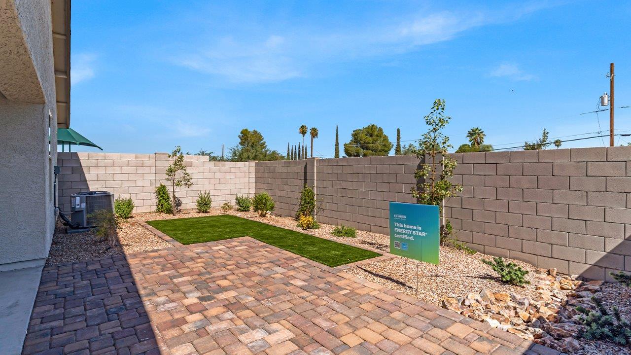 Step into The Gaven, a thoughtfully designed single-story new home nestled within the inviting Senita Crossing community. With 1,776 square feet of living space, this home offers four bedrooms and two bathrooms, ideal for those seeking a blend of functionality and modern style.  As you enter through the front porch, the foyer opens up to reveal a spacious and open layout that flows seamlessly from the entryway to the living areas. The great room serves as the heart of the home, connecting effortlessly to the dining area and kitchen, making it a perfect space for both relaxation and entertaining. The kitchen is a chef's delight, featuring a central island, granite countertops, and Shaker-style cabinetry, providing ample storage and a sleek, modern aesthetic. A large pantry adds to the kitchen’s practicality, ensuring all your culinary essentials are close at hand.  The primary bedroom is strategically placed at the rear of the home, offering a private and serene space complete with a walk-in closet and an en-suite bathroom featuring dual vanities and a spacious shower. The additional three bedrooms are situated toward the front of the home, sharing a full bathroom, making this layout ideal for families or hosting guests.  One of the highlights of The Gaven is its outdoor living space. The covered patio extends from the great room, offering an ideal spot to enjoy Tucson’s beautiful weather. Whether you’re hosting a barbecue, enjoying a quiet morning coffee, or simply relaxing outdoors, this space is designed to enhance your living experience.  Located in the thriving Senita Crossing community on Tucson’s southeast side, residents of The Gaven enjoy a variety of amenities designed for modern living. The community offers easy access to I-10, making commuting a breeze, and is conveniently situated near Davis-Monthan Air Force Base, Raytheon, and the University of Arizona, making it an ideal location for both families and professionals.   Inside The Gaven, you’ll find modern conveniences like 12”x12” ceramic tile flooring, granite countertops, and stainless steel appliances, including a gas range, microwave, and dishwasher. The Home is Connected® Smart Home package, featuring a smart thermostat, video doorbell, and keyless entry, ensures that your home is as functional as it is stylish.  Energy efficiency is a priority at Senita Crossing, with homes that meet DOE Zero Energy Ready standards. Features like tankless water heaters, LED lighting, and advanced spray foam insulation contribute to lower energy costs and a smaller carbon footprint, offering you a sustainable and cost-effective living environment.  Senita Crossing also boasts family-friendly amenities, including a park with a playground, a ramada, and a grassy common area, as well as a maintained bike and walking trail that connects to McCain Loop. The community is served by the highly regarded Sunnyside Unified School District, offering access to top-rated schools, ensuring a bright future for the young ones.  The Gaven at Senita Crossing is more than just a home—it’s a place where comfort, style, and modern living come together to create the perfect environment for you and your family.