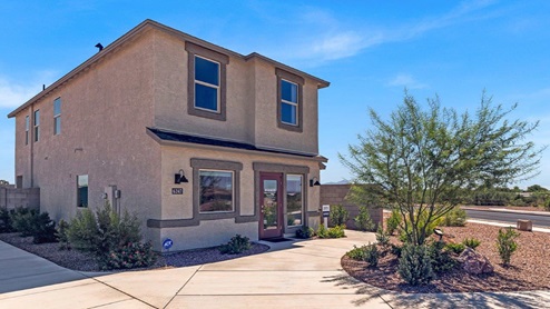 Discover Blackhawk, a vibrant new home community by D.R. Horton in Tucson, Arizona, offering the perfect blend of convenience, quality, and the joys of Arizona living. Located just minutes from I-10, Blackhawk provides easy access to downtown Tucson, the University of Arizona, and major employers like Davis-Monthan Air Force Base, Raytheon, and Tucson International Airport. This prime location ensures that shopping, dining, and entertainment are never far away, making it an ideal choice for families, professionals, and retirees alike. Blackhawk features a range of thoughtfully designed homes, with options ranging from 3 to 5 bedrooms and 1,300 to 2,500 square feet. These homes are crafted for comfort, style, and energy efficiency, featuring granite countertops in the kitchen and bathrooms, tile flooring throughout the main areas, spacious walk-in closets, dual vanities in the master bathroom, and expansive lots for outdoor living. Each home is built with a Spanish lace stucco exterior and comes with a landscaped front yard, complete with an auto drip irrigation system. Additionally, these homes are equipped with D.R. Horton’s Home is Connected Smart Home package, which includes a smart thermostat, video doorbell, keyless entry, Deako Smart Switches, a Wi-Fi-enabled garage door opener and more! Living in Blackhawk means enjoying the benefits of a Zero Energy Ready Home, built to meet rigorous energy efficiency and performance standards. These high-performance homes are designed to save you money on energy costs while reducing your environmental footprint. The community itself offers a variety of amenities, including playgrounds with jungle gyms, parks, ramadas, and walking and biking trails that encourage a healthy, active lifestyle. The Sunnyside School District serves Blackhawk, with top-rated schools like Craycroft Elementary, Billy Lane Middle School, and Desert View High School nearby. Families will appreciate the safe, welcoming environment of the community, as well as the abundance of nearby parks and recreational opportunities. Outdoor enthusiasts will love the proximity to Saguaro National Park, Cienega Creek Natural Preserve, and Del Lago Golf Club, offering endless opportunities for hiking, cycling, and exploring the stunning Arizona landscape. Blackhawk is situated in a rapidly growing area of Tucson, providing affordable housing in a community that is as vibrant as it is welcoming. With ongoing development projects and a strong sense of community, Blackhawk promises a bright future for all its residents. Experience the best of Arizona living at Blackhawk, where quality, convenience, and community come together beautifully.