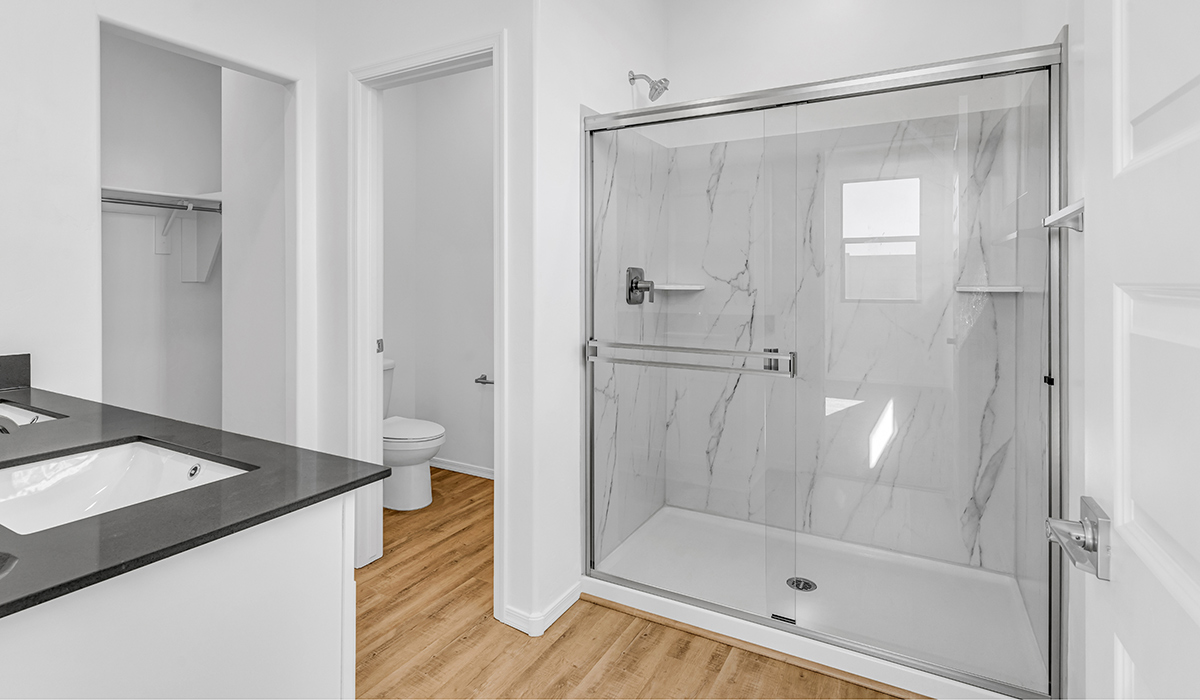 Welcome to The Amber at Blackhawk in Tucson, Arizona – a charming 1,331 sq. ft. single-story new home designed to offer both comfort and style in a prime location.  As you step through the front porch, you're greeted by an inviting entryway that opens up into a beautifully designed living space. The great room serves as the heart of the home, providing a spacious area for relaxing, entertaining, or enjoying family time. This open-concept design flows seamlessly into the dining area and kitchen.  The kitchen is a true centerpiece, featuring elegant quartz countertops, modern appliances, a pantry for ample storage, and a convenient breakfast bar. Whether you’re preparing a quick meal or hosting a dinner party, this kitchen is equipped to meet your needs with both style and functionality.  Just off the great room, you’ll find the primary bedroom – a private retreat designed for relaxation. The primary bedroom is generously sized and includes a walk-in closet and an en-suite bathroom, offering both luxury and convenience.   The Amber also includes two additional bedrooms, well-positioned to share a full bathroom. These rooms are ideal for family members, guests, or even a home office.  For added convenience, the home includes a utility room located near the bedrooms, and a two-car garage that offers both storage and functionality. Step outside to the covered patio, where you can unwind and enjoy Tucson’s beautiful weather year-round. Whether you’re sipping your morning coffee or hosting a weekend barbecue, this outdoor space extends your living area into the serene surroundings of Blackhawk.  Designed with energy efficiency in mind, The Amber at Blackhawk is a DOE Zero Energy Ready Home, ensuring long-term savings and a sustainable living environment.  *Images shown are for reference only. They depict the Amber layout and specification home and may not represent the actual home.