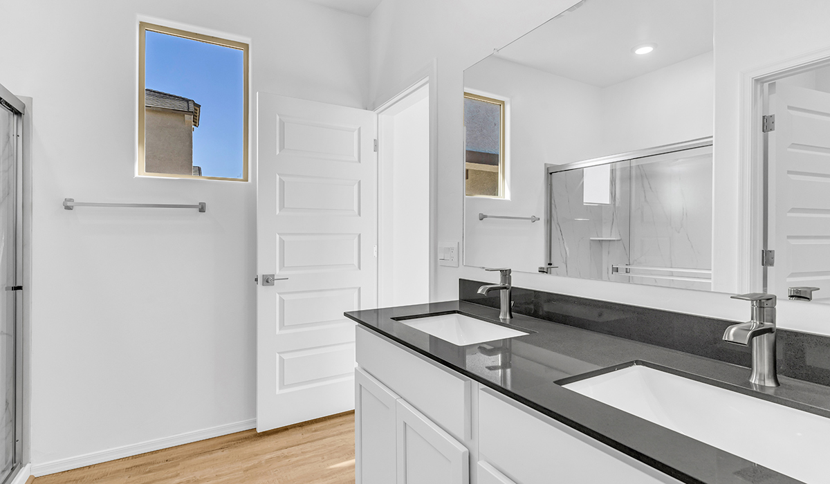 Welcome to The Amber at Blackhawk in Tucson, Arizona – a charming 1,331 sq. ft. single-story new home designed to offer both comfort and style in a prime location.  As you step through the front porch, you're greeted by an inviting entryway that opens up into a beautifully designed living space. The great room serves as the heart of the home, providing a spacious area for relaxing, entertaining, or enjoying family time. This open-concept design flows seamlessly into the dining area and kitchen.  The kitchen is a true centerpiece, featuring elegant quartz countertops, modern appliances, a pantry for ample storage, and a convenient breakfast bar. Whether you’re preparing a quick meal or hosting a dinner party, this kitchen is equipped to meet your needs with both style and functionality.  Just off the great room, you’ll find the primary bedroom – a private retreat designed for relaxation. The primary bedroom is generously sized and includes a walk-in closet and an en-suite bathroom, offering both luxury and convenience.   The Amber also includes two additional bedrooms, well-positioned to share a full bathroom. These rooms are ideal for family members, guests, or even a home office.  For added convenience, the home includes a utility room located near the bedrooms, and a two-car garage that offers both storage and functionality. Step outside to the covered patio, where you can unwind and enjoy Tucson’s beautiful weather year-round. Whether you’re sipping your morning coffee or hosting a weekend barbecue, this outdoor space extends your living area into the serene surroundings of Blackhawk.  Designed with energy efficiency in mind, The Amber at Blackhawk is a DOE Zero Energy Ready Home, ensuring long-term savings and a sustainable living environment.  *Images shown are for reference only. They depict the Amber layout and specification home and may not represent the actual home.