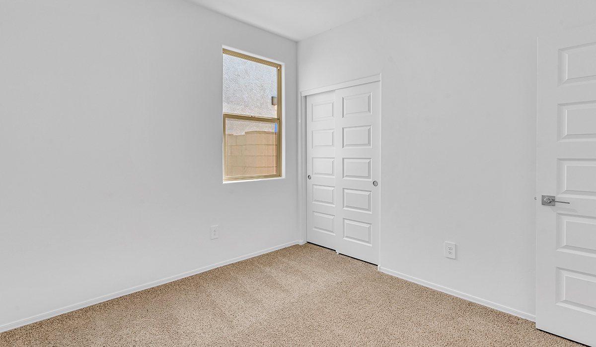 Welcome to The Amber at Blackhawk in Tucson, Arizona – a charming 1,331 sq. ft. single-story new home designed to offer both comfort and style in a prime location.  As you step through the front porch, you're greeted by an inviting entryway that opens up into a beautifully designed living space. The great room serves as the heart of the home, providing a spacious area for relaxing, entertaining, or enjoying family time. This open-concept design flows seamlessly into the dining area and kitchen.  The kitchen is a true centerpiece, featuring elegant quartz countertops, modern appliances, a pantry for ample storage, and a convenient breakfast bar. Whether you’re preparing a quick meal or hosting a dinner party, this kitchen is equipped to meet your needs with both style and functionality.  Just off the great room, you’ll find the primary bedroom – a private retreat designed for relaxation. The primary bedroom is generously sized and includes a walk-in closet and an en-suite bathroom, offering both luxury and convenience.   The Amber also includes two additional bedrooms, well-positioned to share a full bathroom. These rooms are ideal for family members, guests, or even a home office.  For added convenience, the home includes a utility room located near the bedrooms, and a two-car garage that offers both storage and functionality. Step outside to the covered patio, where you can unwind and enjoy Tucson’s beautiful weather year-round. Whether you’re sipping your morning coffee or hosting a weekend barbecue, this outdoor space extends your living area into the serene surroundings of Blackhawk.  Designed with energy efficiency in mind, The Amber at Blackhawk is a DOE Zero Energy Ready Home, ensuring long-term savings and a sustainable living environment.  *Images shown are for reference only. They depict the Amber layout and specification home and may not represent the actual home.