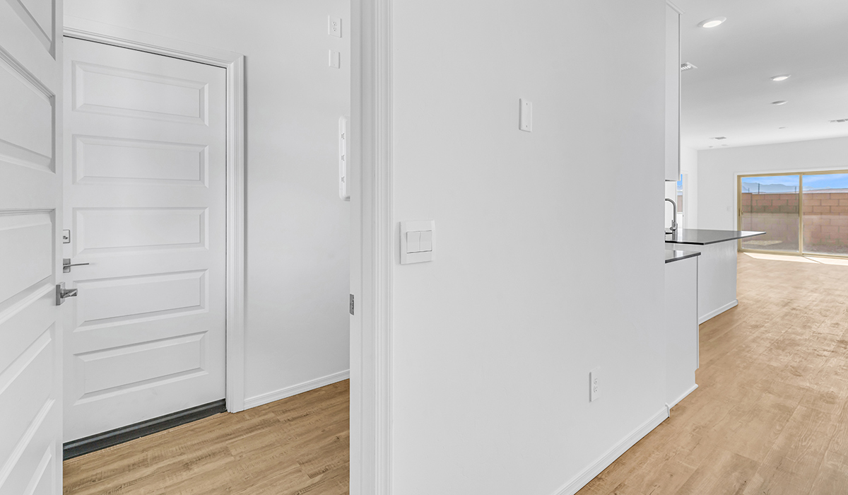 Welcome to The Amber at Blackhawk in Tucson, Arizona – a charming 1,331 sq. ft. single-story new home designed to offer both comfort and style in a prime location.  As you step through the front porch, you're greeted by an inviting entryway that opens up into a beautifully designed living space. The great room serves as the heart of the home, providing a spacious area for relaxing, entertaining, or enjoying family time. This open-concept design flows seamlessly into the dining area and kitchen.  The kitchen is a true centerpiece, featuring elegant quartz countertops, modern appliances, a pantry for ample storage, and a convenient breakfast bar. Whether you’re preparing a quick meal or hosting a dinner party, this kitchen is equipped to meet your needs with both style and functionality.  Just off the great room, you’ll find the primary bedroom – a private retreat designed for relaxation. The primary bedroom is generously sized and includes a walk-in closet and an en-suite bathroom, offering both luxury and convenience.   The Amber also includes two additional bedrooms, well-positioned to share a full bathroom. These rooms are ideal for family members, guests, or even a home office.  For added convenience, the home includes a utility room located near the bedrooms, and a two-car garage that offers both storage and functionality. Step outside to the covered patio, where you can unwind and enjoy Tucson’s beautiful weather year-round. Whether you’re sipping your morning coffee or hosting a weekend barbecue, this outdoor space extends your living area into the serene surroundings of Blackhawk.  Designed with energy efficiency in mind, The Amber at Blackhawk is a DOE Zero Energy Ready Home, ensuring long-term savings and a sustainable living environment.  *Images shown are for reference only. They depict the Amber model and may not represent the actual home.