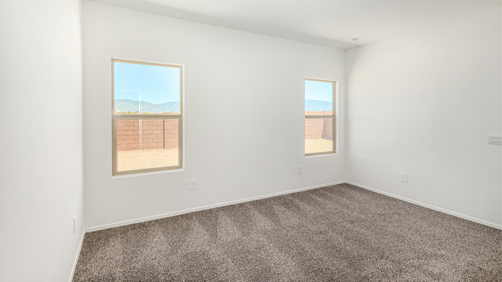 Welcome to The Amber at Blackhawk in Tucson, Arizona – a charming 1,331 sq. ft. single-story new home designed to offer both comfort and style in a prime location.  As you step through the front porch, you're greeted by an inviting entryway that opens up into a beautifully designed living space. The great room serves as the heart of the home, providing a spacious area for relaxing, entertaining, or enjoying family time. This open-concept design flows seamlessly into the dining area and kitchen.  The kitchen is a true centerpiece, featuring elegant quartz countertops, modern appliances, a pantry for ample storage, and a convenient breakfast bar. Whether you’re preparing a quick meal or hosting a dinner party, this kitchen is equipped to meet your needs with both style and functionality.  Just off the great room, you’ll find the primary bedroom – a private retreat designed for relaxation. The primary bedroom is generously sized and includes a walk-in closet and an en-suite bathroom, offering both luxury and convenience.   The Amber also includes two additional bedrooms, well-positioned to share a full bathroom. These rooms are ideal for family members, guests, or even a home office.  For added convenience, the home includes a utility room located near the bedrooms, and a two-car garage that offers both storage and functionality. Step outside to the covered patio, where you can unwind and enjoy Tucson’s beautiful weather year-round. Whether you’re sipping your morning coffee or hosting a weekend barbecue, this outdoor space extends your living area into the serene surroundings of Blackhawk.  Designed with energy efficiency in mind, The Amber at Blackhawk is a DOE Zero Energy Ready Home, ensuring long-term savings and a sustainable living environment.  *Images shown are for reference only. They depict the Amber model and may not represent the actual home.