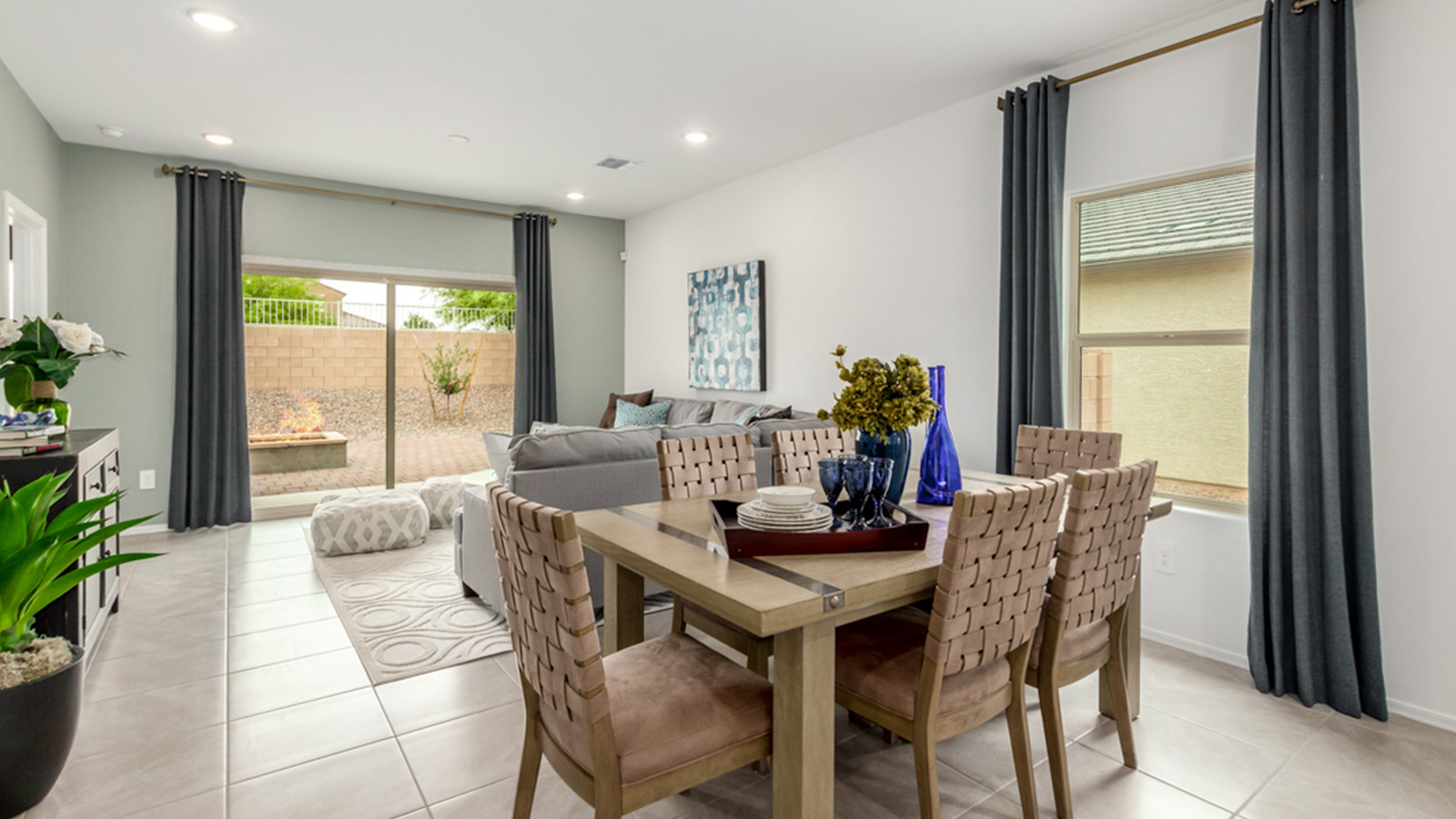 Welcome to The Amber at Blackhawk in Tucson, Arizona – a charming 1,331 sq. ft. single-story new home designed to offer both comfort and style in a prime location.  As you step through the front porch, you're greeted by an inviting entryway that opens up into a beautifully designed living space. The great room serves as the heart of the home, providing a spacious area for relaxing, entertaining, or enjoying family time. This open-concept design flows seamlessly into the dining area and kitchen.  The kitchen is a true centerpiece, featuring elegant quartz countertops, modern appliances, a pantry for ample storage, and a convenient breakfast bar. Whether you’re preparing a quick meal or hosting a dinner party, this kitchen is equipped to meet your needs with both style and functionality.  Just off the great room, you’ll find the primary bedroom – a private retreat designed for relaxation. The primary bedroom is generously sized and includes a walk-in closet and an en-suite bathroom, offering both luxury and convenience.   The Amber also includes two additional bedrooms, well-positioned to share a full bathroom. These rooms are ideal for family members, guests, or even a home office.  For added convenience, the home includes a utility room located near the bedrooms, and a two-car garage that offers both storage and functionality. Step outside to the covered patio, where you can unwind and enjoy Tucson’s beautiful weather year-round. Whether you’re sipping your morning coffee or hosting a weekend barbecue, this outdoor space extends your living area into the serene surroundings of Blackhawk.  Designed with energy efficiency in mind, The Amber at Blackhawk is a DOE Zero Energy Ready Home, ensuring long-term savings and a sustainable living environment.  *Images shown are for reference only. They depict the Amber model and may not represent the actual home.