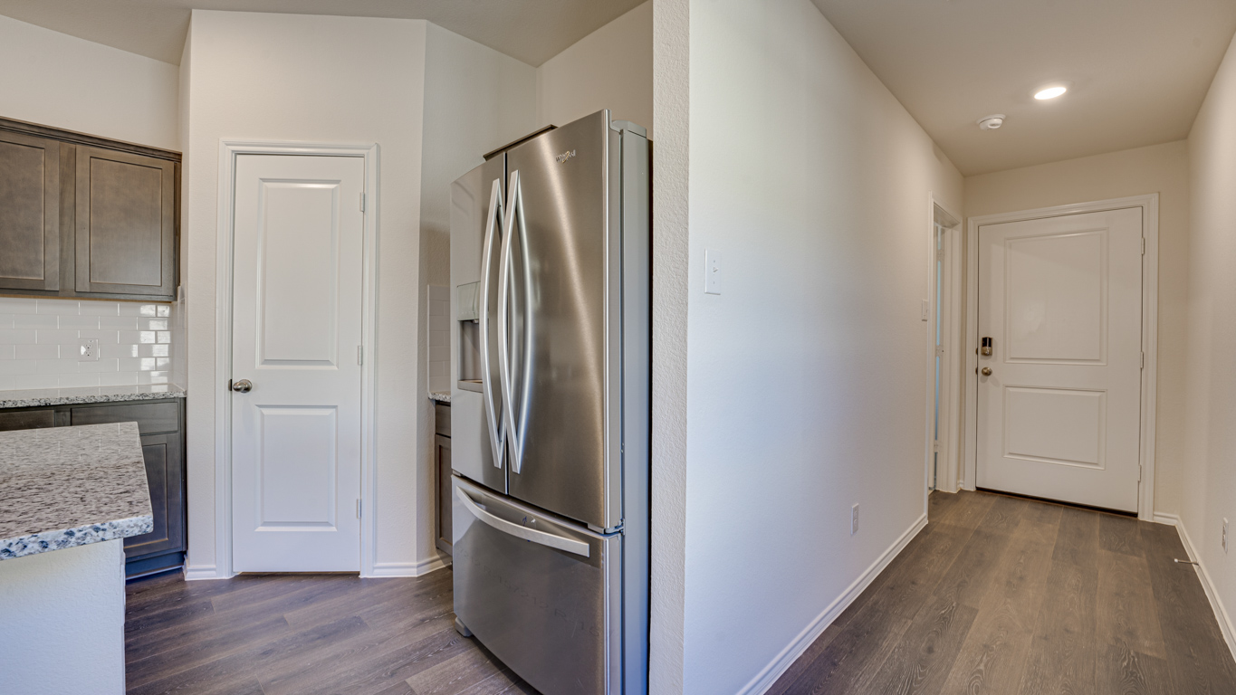 Welcome to The Amber at Blackhawk in Tucson, Arizona – a charming 1,331 sq. ft. single-story new home designed to offer both comfort and style in a prime location.  As you step through the front porch, you're greeted by an inviting entryway that opens up into a beautifully designed living space. The great room serves as the heart of the home, providing a spacious area for relaxing, entertaining, or enjoying family time. This open-concept design flows seamlessly into the dining area and kitchen.  The kitchen is a true centerpiece, featuring elegant quartz countertops, modern appliances, a pantry for ample storage, and a convenient breakfast bar. Whether you’re preparing a quick meal or hosting a dinner party, this kitchen is equipped to meet your needs with both style and functionality.  Just off the great room, you’ll find the primary bedroom – a private retreat designed for relaxation. The primary bedroom is generously sized and includes a walk-in closet and an en-suite bathroom, offering both luxury and convenience.   The Amber also includes two additional bedrooms, well-positioned to share a full bathroom. These rooms are ideal for family members, guests, or even a home office.  For added convenience, the home includes a utility room located near the bedrooms, and a two-car garage that offers both storage and functionality. Step outside to the covered patio, where you can unwind and enjoy Tucson’s beautiful weather year-round. Whether you’re sipping your morning coffee or hosting a weekend barbecue, this outdoor space extends your living area into the serene surroundings of Blackhawk.  Designed with energy efficiency in mind, The Amber at Blackhawk is a DOE Zero Energy Ready Home, ensuring long-term savings and a sustainable living environment.  *Images shown are for reference only. They depict the Amber model and may not represent the actual home.