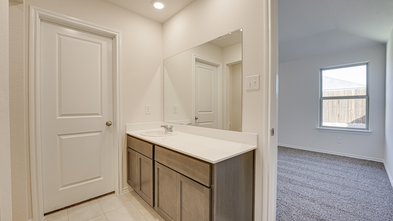 Welcome to The Amber at Blackhawk in Tucson, Arizona – a charming 1,331 sq. ft. single-story new home designed to offer both comfort and style in a prime location.  As you step through the front porch, you're greeted by an inviting entryway that opens up into a beautifully designed living space. The great room serves as the heart of the home, providing a spacious area for relaxing, entertaining, or enjoying family time. This open-concept design flows seamlessly into the dining area and kitchen.  The kitchen is a true centerpiece, featuring elegant quartz countertops, modern appliances, a pantry for ample storage, and a convenient breakfast bar. Whether you’re preparing a quick meal or hosting a dinner party, this kitchen is equipped to meet your needs with both style and functionality.  Just off the great room, you’ll find the primary bedroom – a private retreat designed for relaxation. The primary bedroom is generously sized and includes a walk-in closet and an en-suite bathroom, offering both luxury and convenience.   The Amber also includes two additional bedrooms, well-positioned to share a full bathroom. These rooms are ideal for family members, guests, or even a home office.  For added convenience, the home includes a utility room located near the bedrooms, and a two-car garage that offers both storage and functionality. Step outside to the covered patio, where you can unwind and enjoy Tucson’s beautiful weather year-round. Whether you’re sipping your morning coffee or hosting a weekend barbecue, this outdoor space extends your living area into the serene surroundings of Blackhawk.  Designed with energy efficiency in mind, The Amber at Blackhawk is a DOE Zero Energy Ready Home, ensuring long-term savings and a sustainable living environment.  *Images shown are for reference only. They depict the Amber model and may not represent the actual home.