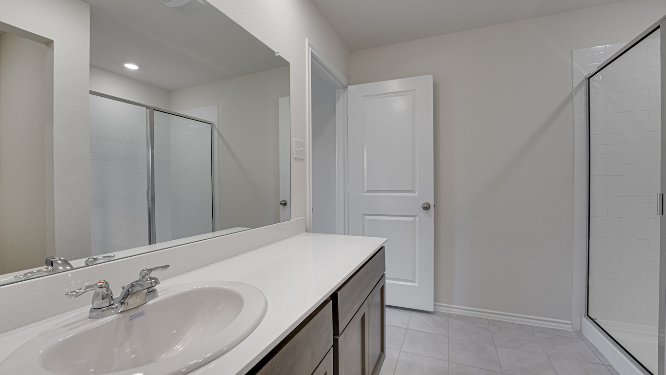 Welcome to The Amber at Blackhawk in Tucson, Arizona – a charming 1,331 sq. ft. single-story new home designed to offer both comfort and style in a prime location.  As you step through the front porch, you're greeted by an inviting entryway that opens up into a beautifully designed living space. The great room serves as the heart of the home, providing a spacious area for relaxing, entertaining, or enjoying family time. This open-concept design flows seamlessly into the dining area and kitchen.  The kitchen is a true centerpiece, featuring elegant quartz countertops, modern appliances, a pantry for ample storage, and a convenient breakfast bar. Whether you’re preparing a quick meal or hosting a dinner party, this kitchen is equipped to meet your needs with both style and functionality.  Just off the great room, you’ll find the primary bedroom – a private retreat designed for relaxation. The primary bedroom is generously sized and includes a walk-in closet and an en-suite bathroom, offering both luxury and convenience.   The Amber also includes two additional bedrooms, well-positioned to share a full bathroom. These rooms are ideal for family members, guests, or even a home office.  For added convenience, the home includes a utility room located near the bedrooms, and a two-car garage that offers both storage and functionality. Step outside to the covered patio, where you can unwind and enjoy Tucson’s beautiful weather year-round. Whether you’re sipping your morning coffee or hosting a weekend barbecue, this outdoor space extends your living area into the serene surroundings of Blackhawk.  Designed with energy efficiency in mind, The Amber at Blackhawk is a DOE Zero Energy Ready Home, ensuring long-term savings and a sustainable living environment.  *Images shown are for reference only. They depict the Amber model and may not represent the actual home.