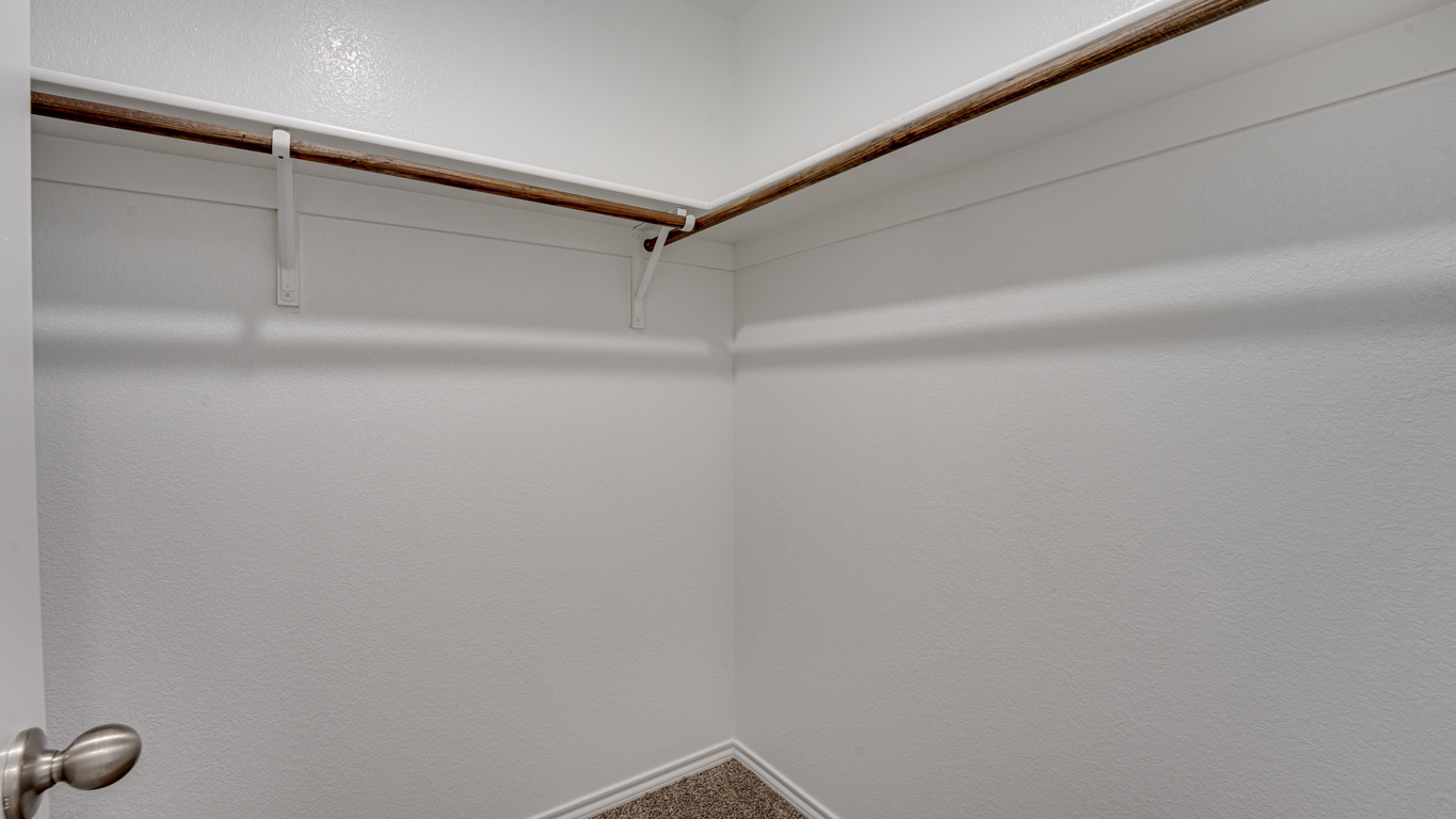 Welcome to The Amber at Blackhawk in Tucson, Arizona – a charming 1,331 sq. ft. single-story new home designed to offer both comfort and style in a prime location.  As you step through the front porch, you're greeted by an inviting entryway that opens up into a beautifully designed living space. The great room serves as the heart of the home, providing a spacious area for relaxing, entertaining, or enjoying family time. This open-concept design flows seamlessly into the dining area and kitchen.  The kitchen is a true centerpiece, featuring elegant quartz countertops, modern appliances, a pantry for ample storage, and a convenient breakfast bar. Whether you’re preparing a quick meal or hosting a dinner party, this kitchen is equipped to meet your needs with both style and functionality.  Just off the great room, you’ll find the primary bedroom – a private retreat designed for relaxation. The primary bedroom is generously sized and includes a walk-in closet and an en-suite bathroom, offering both luxury and convenience.   The Amber also includes two additional bedrooms, well-positioned to share a full bathroom. These rooms are ideal for family members, guests, or even a home office.  For added convenience, the home includes a utility room located near the bedrooms, and a two-car garage that offers both storage and functionality. Step outside to the covered patio, where you can unwind and enjoy Tucson’s beautiful weather year-round. Whether you’re sipping your morning coffee or hosting a weekend barbecue, this outdoor space extends your living area into the serene surroundings of Blackhawk.  Designed with energy efficiency in mind, The Amber at Blackhawk is a DOE Zero Energy Ready Home, ensuring long-term savings and a sustainable living environment.  *Images shown are for reference only. They depict the Amber model and may not represent the actual home.