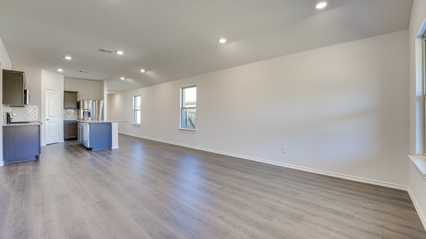 Welcome to The Amber at Blackhawk in Tucson, Arizona – a charming 1,331 sq. ft. single-story new home designed to offer both comfort and style in a prime location.  As you step through the front porch, you're greeted by an inviting entryway that opens up into a beautifully designed living space. The great room serves as the heart of the home, providing a spacious area for relaxing, entertaining, or enjoying family time. This open-concept design flows seamlessly into the dining area and kitchen.  The kitchen is a true centerpiece, featuring elegant quartz countertops, modern appliances, a pantry for ample storage, and a convenient breakfast bar. Whether you’re preparing a quick meal or hosting a dinner party, this kitchen is equipped to meet your needs with both style and functionality.  Just off the great room, you’ll find the primary bedroom – a private retreat designed for relaxation. The primary bedroom is generously sized and includes a walk-in closet and an en-suite bathroom, offering both luxury and convenience.   The Amber also includes two additional bedrooms, well-positioned to share a full bathroom. These rooms are ideal for family members, guests, or even a home office.  For added convenience, the home includes a utility room located near the bedrooms, and a two-car garage that offers both storage and functionality. Step outside to the covered patio, where you can unwind and enjoy Tucson’s beautiful weather year-round. Whether you’re sipping your morning coffee or hosting a weekend barbecue, this outdoor space extends your living area into the serene surroundings of Blackhawk.  Designed with energy efficiency in mind, The Amber at Blackhawk is a DOE Zero Energy Ready Home, ensuring long-term savings and a sustainable living environment.  *Images shown are for reference only. They depict the Amber model and may not represent the actual home.