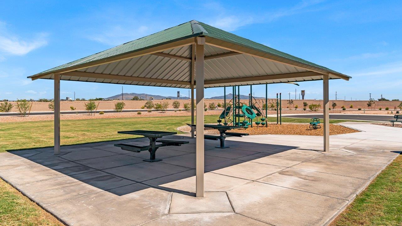 Welcome to The Amber at Blackhawk in Tucson, Arizona – a charming 1,331 sq. ft. single-story new home designed to offer both comfort and style in a prime location.  As you step through the front porch, you're greeted by an inviting entryway that opens up into a beautifully designed living space. The great room serves as the heart of the home, providing a spacious area for relaxing, entertaining, or enjoying family time. This open-concept design flows seamlessly into the dining area and kitchen.  The kitchen is a true centerpiece, featuring elegant quartz countertops, modern appliances, a pantry for ample storage, and a convenient breakfast bar. Whether you’re preparing a quick meal or hosting a dinner party, this kitchen is equipped to meet your needs with both style and functionality.  Just off the great room, you’ll find the primary bedroom – a private retreat designed for relaxation. The primary bedroom is generously sized and includes a walk-in closet and an en-suite bathroom, offering both luxury and convenience.   The Amber also includes two additional bedrooms, well-positioned to share a full bathroom. These rooms are ideal for family members, guests, or even a home office.  For added convenience, the home includes a utility room located near the bedrooms, and a two-car garage that offers both storage and functionality. Step outside to the covered patio, where you can unwind and enjoy Tucson’s beautiful weather year-round. Whether you’re sipping your morning coffee or hosting a weekend barbecue, this outdoor space extends your living area into the serene surroundings of Blackhawk.  Designed with energy efficiency in mind, The Amber at Blackhawk is a DOE Zero Energy Ready Home, ensuring long-term savings and a sustainable living environment.  *Images shown are for reference only. They depict the Amber model and may not represent the actual home.