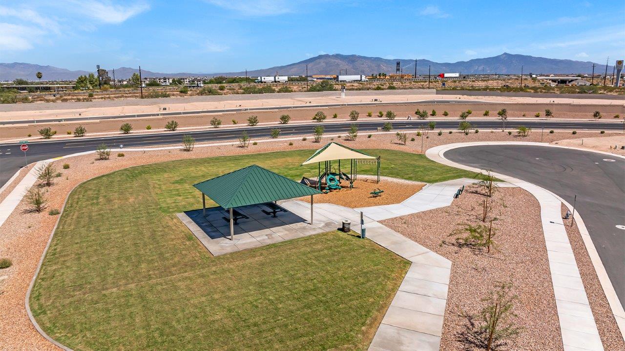 Welcome to The Diana at Blackhawk in Tucson, Arizona – a spacious 1,558 sq. ft. single-story new home designed to offer comfort, style, and energy efficiency in a prime location.  As you enter through the inviting front porch, you're greeted by a well-designed entryway that leads into an open-concept living area. The great room is the centerpiece of the home, providing a generous space for relaxing, entertaining, or enjoying quality time with family. It seamlessly flows into the dining area and kitchen, creating a bright and welcoming atmosphere perfect for any occasion.  The kitchen is thoughtfully designed with modern touches, including elegant granite countertops, a pantry for ample storage, and a large island with a breakfast bar that makes both meal preparation and casual dining a breeze. The open layout ensures that the kitchen is always connected to the rest of the living space, making it easy to interact with family and guests.  Adjacent to the great room, you’ll find the master suite, offering a private retreat within the home. The master bedroom is generously sized, featuring a spacious walk-in closet and an en-suite bathroom with dual vanities and a walk-in shower, providing both luxury and convenience.  The Diana also includes two additional bedrooms, well-positioned to share a full bathroom. These rooms are ideal for family members, guests, or even a home office, offering flexible living options to suit your needs.  A utility room and a two-car garage add to the home’s practicality, ensuring that daily routines are efficient and organized. Step outside to the covered patio, where you can unwind and enjoy Tucson’s beautiful weather, whether it’s a quiet morning coffee or an evening gathering with friends.  Designed with energy efficiency in mind, The Diana at Blackhawk is a DOE Zero Energy Ready Home, ensuring long-term savings and a sustainable living environment.