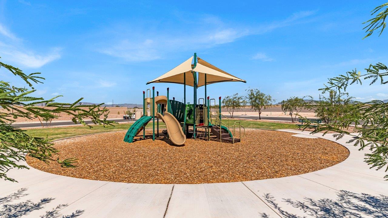 Welcome to The Diana at Blackhawk in Tucson, Arizona – a spacious 1,558 sq. ft. single-story new home designed to offer comfort, style, and energy efficiency in a prime location.  As you enter through the inviting front porch, you're greeted by a well-designed entryway that leads into an open-concept living area. The great room is the centerpiece of the home, providing a generous space for relaxing, entertaining, or enjoying quality time with family. It seamlessly flows into the dining area and kitchen, creating a bright and welcoming atmosphere perfect for any occasion.  The kitchen is thoughtfully designed with modern touches, including elegant granite countertops, a pantry for ample storage, and a large island with a breakfast bar that makes both meal preparation and casual dining a breeze. The open layout ensures that the kitchen is always connected to the rest of the living space, making it easy to interact with family and guests.  Adjacent to the great room, you’ll find the master suite, offering a private retreat within the home. The master bedroom is generously sized, featuring a spacious walk-in closet and an en-suite bathroom with dual vanities and a walk-in shower, providing both luxury and convenience.  The Diana also includes two additional bedrooms, well-positioned to share a full bathroom. These rooms are ideal for family members, guests, or even a home office, offering flexible living options to suit your needs.  A utility room and a two-car garage add to the home’s practicality, ensuring that daily routines are efficient and organized. Step outside to the covered patio, where you can unwind and enjoy Tucson’s beautiful weather, whether it’s a quiet morning coffee or an evening gathering with friends.  Designed with energy efficiency in mind, The Diana at Blackhawk is a DOE Zero Energy Ready Home, ensuring long-term savings and a sustainable living environment.