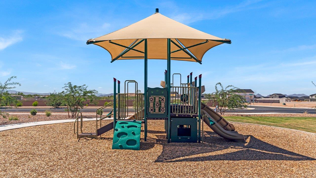 Welcome to The Diana at Blackhawk in Tucson, Arizona – a spacious 1,558 sq. ft. single-story new home designed to offer comfort, style, and energy efficiency in a prime location.  As you enter through the inviting front porch, you're greeted by a well-designed entryway that leads into an open-concept living area. The great room is the centerpiece of the home, providing a generous space for relaxing, entertaining, or enjoying quality time with family. It seamlessly flows into the dining area and kitchen, creating a bright and welcoming atmosphere perfect for any occasion.  The kitchen is thoughtfully designed with modern touches, including elegant granite countertops, a pantry for ample storage, and a large island with a breakfast bar that makes both meal preparation and casual dining a breeze. The open layout ensures that the kitchen is always connected to the rest of the living space, making it easy to interact with family and guests.  Adjacent to the great room, you’ll find the master suite, offering a private retreat within the home. The master bedroom is generously sized, featuring a spacious walk-in closet and an en-suite bathroom with dual vanities and a walk-in shower, providing both luxury and convenience.  The Diana also includes two additional bedrooms, well-positioned to share a full bathroom. These rooms are ideal for family members, guests, or even a home office, offering flexible living options to suit your needs.  A utility room and a two-car garage add to the home’s practicality, ensuring that daily routines are efficient and organized. Step outside to the covered patio, where you can unwind and enjoy Tucson’s beautiful weather, whether it’s a quiet morning coffee or an evening gathering with friends.  Designed with energy efficiency in mind, The Diana at Blackhawk is a DOE Zero Energy Ready Home, ensuring long-term savings and a sustainable living environment.