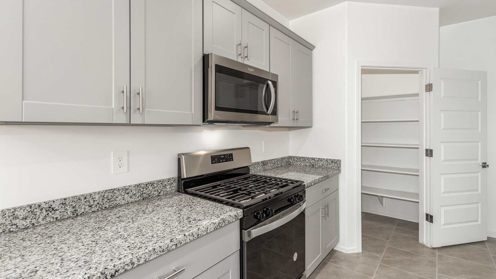 Introducing The Grace at Blackhawk in Tucson, Arizona – a spacious 1,963 sq. ft. two-story new home designed to accommodate modern living with style and functionality.  As you step through the welcoming front porch, you’re greeted by an open and inviting entryway that leads directly into the heart of the home. The main level features a spacious great room that flows seamlessly into the dining area and the modern kitchen, creating a perfect space for entertaining and family gatherings. The kitchen is equipped with elegant granite countertops, a large island with a breakfast bar, modern appliances, and a pantry that offers plenty of storage, making it as functional as it is stylish.  The main floor also includes a convenient powder room for guests, and direct access to the two-car garage, enhancing the home’s functionality and ease of living.  Heading upstairs, you'll discover the family’s private quarters. The master suite is a serene retreat, featuring a generously sized bedroom, a large walk-in closet, and an en-suite bathroom complete with dual vanities and a walk-in shower. The upper level also includes three additional bedrooms, a full bathroom, and a utility room conveniently located for easy access to all bedrooms. Additionally, a versatile loft area serves as a flexible space that can be used as a game room, home office, or even a second living area.  Back downstairs, step outside from the great room to the covered patio, where you can enjoy Tucson’s beautiful weather year-round. Whether you’re hosting an outdoor gathering or simply relaxing after a long day, this space extends your living area and enhances the home’s inviting ambiance.  Designed with energy efficiency in mind, The Grace at Blackhawk is a DOE Zero Energy Ready Home, ensuring sustainability, comfort, and long-term savings.