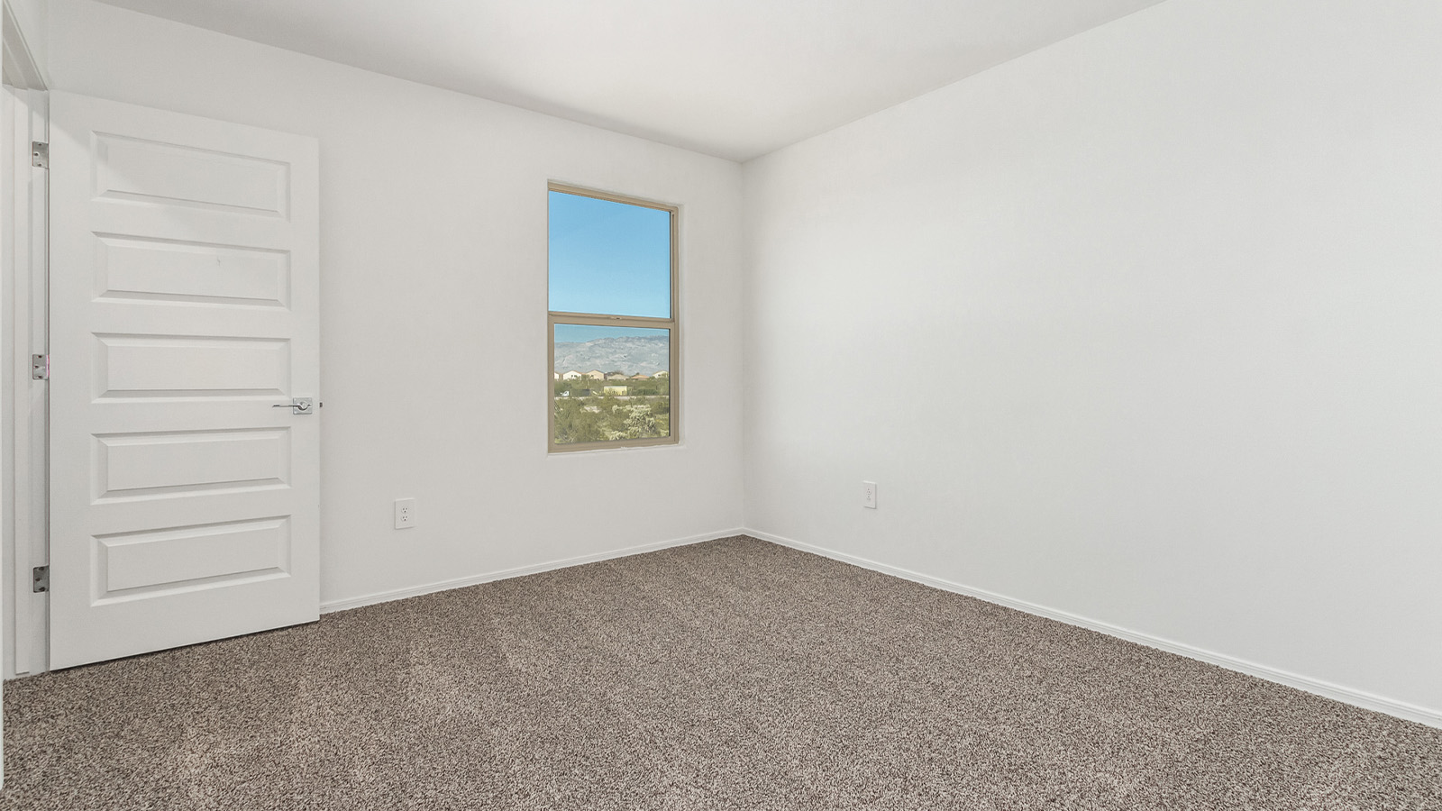 Introducing The Grace at Blackhawk in Tucson, Arizona – a spacious 1,963 sq. ft. two-story new home designed to accommodate modern living with style and functionality.  As you step through the welcoming front porch, you’re greeted by an open and inviting entryway that leads directly into the heart of the home. The main level features a spacious great room that flows seamlessly into the dining area and the modern kitchen, creating a perfect space for entertaining and family gatherings. The kitchen is equipped with elegant granite countertops, a large island with a breakfast bar, modern appliances, and a pantry that offers plenty of storage, making it as functional as it is stylish.  The main floor also includes a convenient powder room for guests, and direct access to the two-car garage, enhancing the home’s functionality and ease of living.  Heading upstairs, you'll discover the family’s private quarters. The master suite is a serene retreat, featuring a generously sized bedroom, a large walk-in closet, and an en-suite bathroom complete with dual vanities and a walk-in shower. The upper level also includes three additional bedrooms, a full bathroom, and a utility room conveniently located for easy access to all bedrooms. Additionally, a versatile loft area serves as a flexible space that can be used as a game room, home office, or even a second living area.  Back downstairs, step outside from the great room to the covered patio, where you can enjoy Tucson’s beautiful weather year-round. Whether you’re hosting an outdoor gathering or simply relaxing after a long day, this space extends your living area and enhances the home’s inviting ambiance.  Designed with energy efficiency in mind, The Grace at Blackhawk is a DOE Zero Energy Ready Home, ensuring sustainability, comfort, and long-term savings.