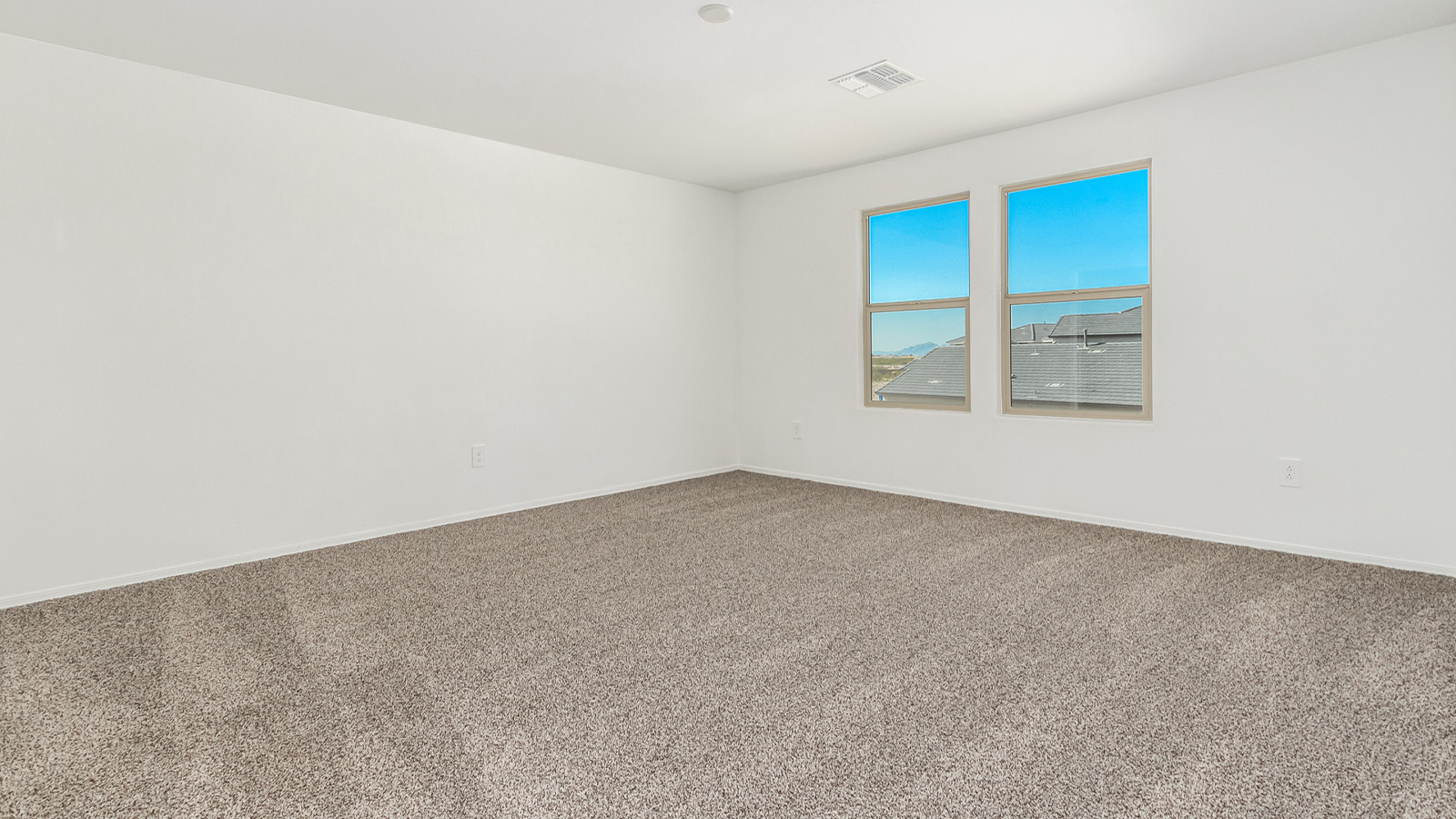 Introducing The Grace at Blackhawk in Tucson, Arizona – a spacious 1,963 sq. ft. two-story new home designed to accommodate modern living with style and functionality.  As you step through the welcoming front porch, you’re greeted by an open and inviting entryway that leads directly into the heart of the home. The main level features a spacious great room that flows seamlessly into the dining area and the modern kitchen, creating a perfect space for entertaining and family gatherings. The kitchen is equipped with elegant granite countertops, a large island with a breakfast bar, modern appliances, and a pantry that offers plenty of storage, making it as functional as it is stylish.  The main floor also includes a convenient powder room for guests, and direct access to the two-car garage, enhancing the home’s functionality and ease of living.  Heading upstairs, you'll discover the family’s private quarters. The master suite is a serene retreat, featuring a generously sized bedroom, a large walk-in closet, and an en-suite bathroom complete with dual vanities and a walk-in shower. The upper level also includes three additional bedrooms, a full bathroom, and a utility room conveniently located for easy access to all bedrooms. Additionally, a versatile loft area serves as a flexible space that can be used as a game room, home office, or even a second living area.  Back downstairs, step outside from the great room to the covered patio, where you can enjoy Tucson’s beautiful weather year-round. Whether you’re hosting an outdoor gathering or simply relaxing after a long day, this space extends your living area and enhances the home’s inviting ambiance.  Designed with energy efficiency in mind, The Grace at Blackhawk is a DOE Zero Energy Ready Home, ensuring sustainability, comfort, and long-term savings.