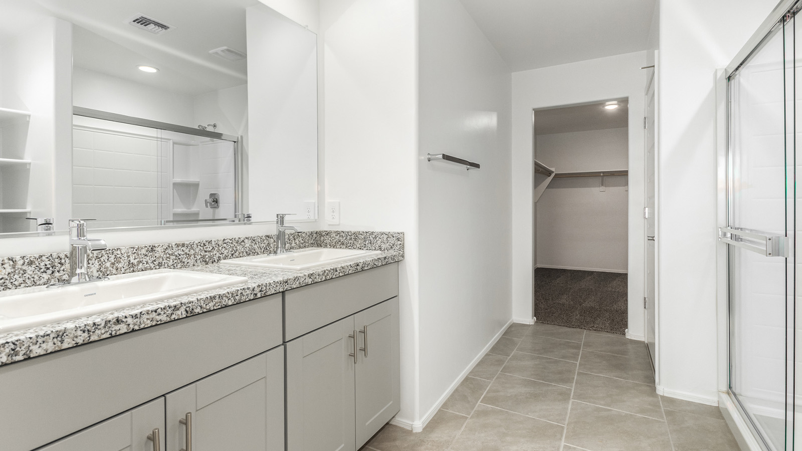 Introducing The Grace at Blackhawk in Tucson, Arizona – a spacious 1,963 sq. ft. two-story new home designed to accommodate modern living with style and functionality.  As you step through the welcoming front porch, you’re greeted by an open and inviting entryway that leads directly into the heart of the home. The main level features a spacious great room that flows seamlessly into the dining area and the modern kitchen, creating a perfect space for entertaining and family gatherings. The kitchen is equipped with elegant granite countertops, a large island with a breakfast bar, modern appliances, and a pantry that offers plenty of storage, making it as functional as it is stylish.  The main floor also includes a convenient powder room for guests, and direct access to the two-car garage, enhancing the home’s functionality and ease of living.  Heading upstairs, you'll discover the family’s private quarters. The master suite is a serene retreat, featuring a generously sized bedroom, a large walk-in closet, and an en-suite bathroom complete with dual vanities and a walk-in shower. The upper level also includes three additional bedrooms, a full bathroom, and a utility room conveniently located for easy access to all bedrooms. Additionally, a versatile loft area serves as a flexible space that can be used as a game room, home office, or even a second living area.  Back downstairs, step outside from the great room to the covered patio, where you can enjoy Tucson’s beautiful weather year-round. Whether you’re hosting an outdoor gathering or simply relaxing after a long day, this space extends your living area and enhances the home’s inviting ambiance.  Designed with energy efficiency in mind, The Grace at Blackhawk is a DOE Zero Energy Ready Home, ensuring sustainability, comfort, and long-term savings.