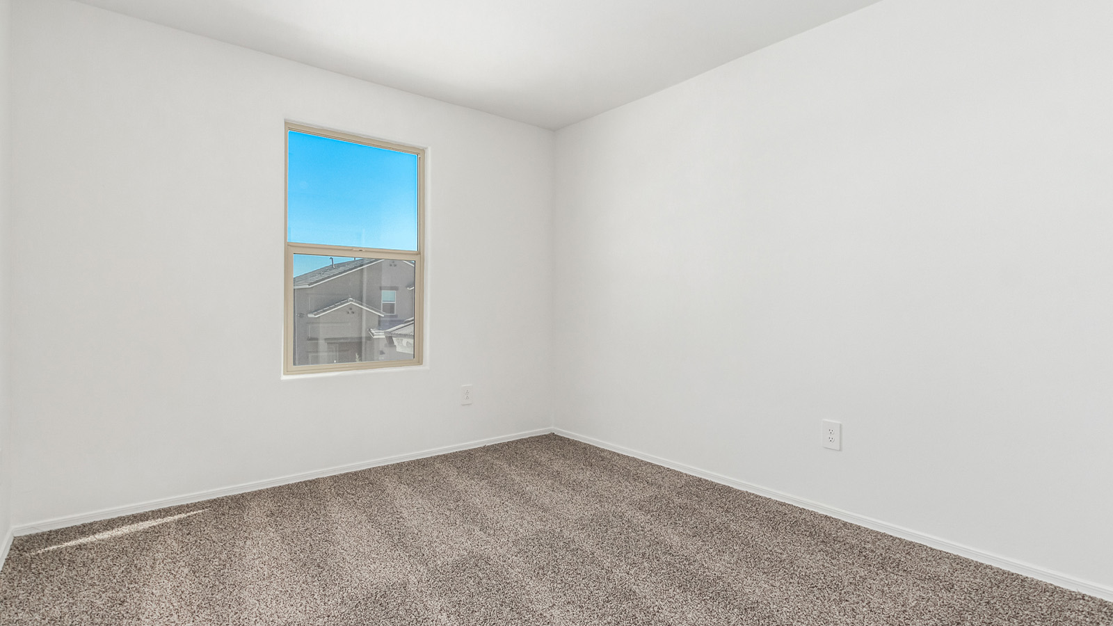 Introducing The Grace at Blackhawk in Tucson, Arizona – a spacious 1,963 sq. ft. two-story new home designed to accommodate modern living with style and functionality.  As you step through the welcoming front porch, you’re greeted by an open and inviting entryway that leads directly into the heart of the home. The main level features a spacious great room that flows seamlessly into the dining area and the modern kitchen, creating a perfect space for entertaining and family gatherings. The kitchen is equipped with elegant granite countertops, a large island with a breakfast bar, modern appliances, and a pantry that offers plenty of storage, making it as functional as it is stylish.  The main floor also includes a convenient powder room for guests, and direct access to the two-car garage, enhancing the home’s functionality and ease of living.  Heading upstairs, you'll discover the family’s private quarters. The master suite is a serene retreat, featuring a generously sized bedroom, a large walk-in closet, and an en-suite bathroom complete with dual vanities and a walk-in shower. The upper level also includes three additional bedrooms, a full bathroom, and a utility room conveniently located for easy access to all bedrooms. Additionally, a versatile loft area serves as a flexible space that can be used as a game room, home office, or even a second living area.  Back downstairs, step outside from the great room to the covered patio, where you can enjoy Tucson’s beautiful weather year-round. Whether you’re hosting an outdoor gathering or simply relaxing after a long day, this space extends your living area and enhances the home’s inviting ambiance.  Designed with energy efficiency in mind, The Grace at Blackhawk is a DOE Zero Energy Ready Home, ensuring sustainability, comfort, and long-term savings.