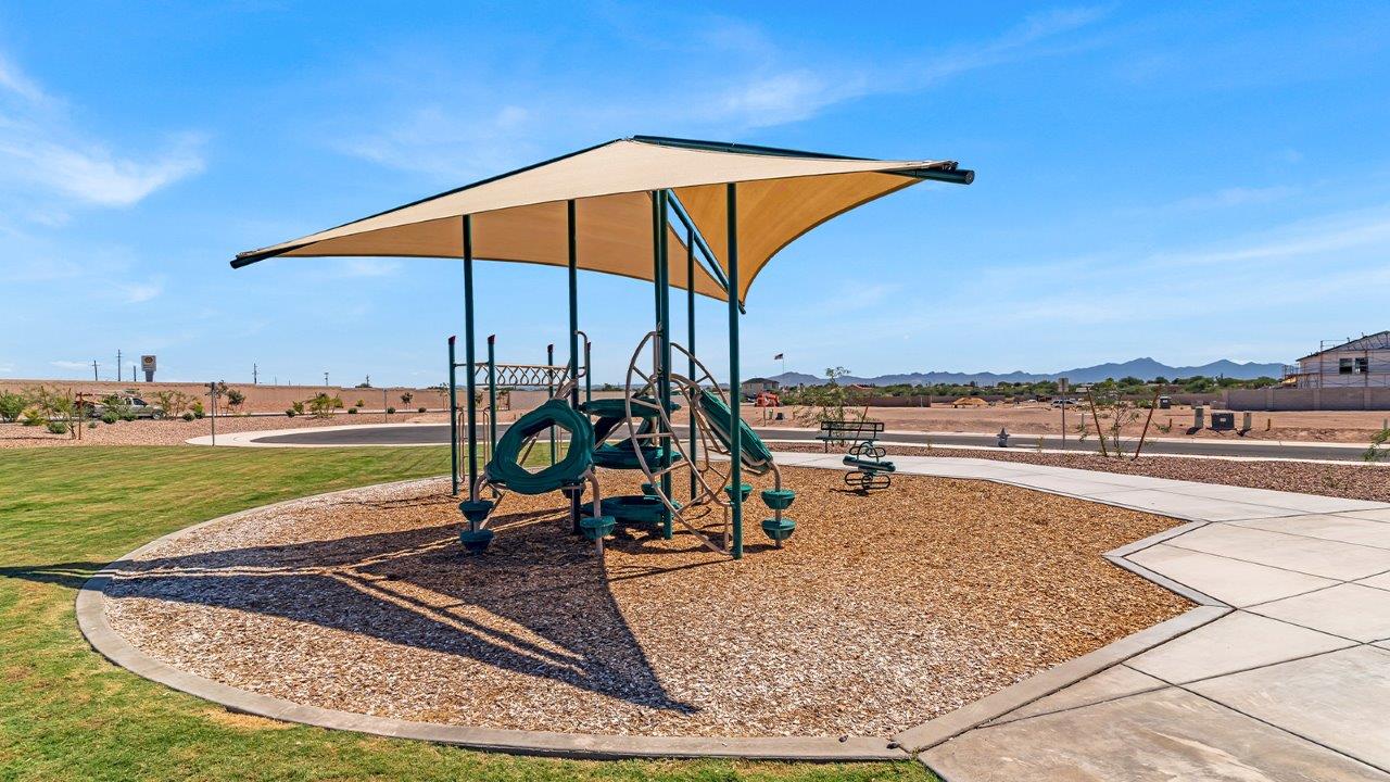 Introducing The Kate at Blackhawk in Tucson, Arizona – a spacious 2,264 sq. ft. two-story new home designed to offer both comfort and modern living in a prime location.  As you step through the inviting front porch, you’re welcomed into a thoughtfully designed entryway that leads directly into the heart of the home. The main floor boasts a generous great room that seamlessly connects to the dining area and kitchen, creating an ideal space for entertaining and everyday living. The kitchen is equipped with sleek granite countertops, a large island with a breakfast bar, modern appliances, and a pantry that provides ample storage, ensuring that the kitchen is both functional and stylish.  The main level also features a convenient powder room, perfect for guests, and direct access to the two-car garage, enhancing the home’s practicality.  Heading upstairs, you’ll discover the family’s private quarters. The master suite offers a serene retreat, complete with a spacious bedroom, a large walk-in closet, and an en-suite bathroom featuring dual vanities and a walk-in shower. The upper level also includes three additional bedrooms, a full bathroom, and a utility room centrally located for easy access. Additionally, a versatile loft area provides extra space that can be tailored to fit your lifestyle, whether as a game room, home office, or a second living area.  Step outside from the great room to the covered patio, where you can enjoy Tucson’s beautiful weather year-round. Whether you’re hosting an outdoor gathering or simply relaxing after a long day, this space extends your living area and enhances the home’s inviting ambiance.  Designed with energy efficiency in mind, The Kate at Blackhawk is a DOE Zero Energy Ready Home, combining sustainability, comfort, and long-term savings.