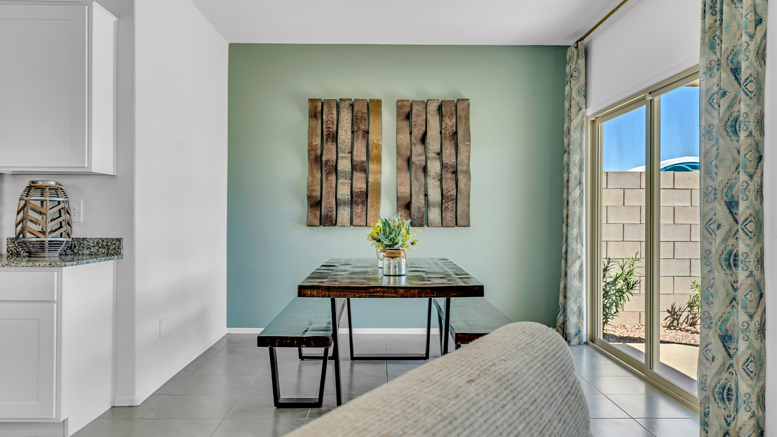 Introducing The Kate at Blackhawk in Tucson, Arizona – a spacious 2,264 sq. ft. two-story new home designed to offer both comfort and modern living in a prime location.  As you step through the inviting front porch, you’re welcomed into a thoughtfully designed entryway that leads directly into the heart of the home. The main floor boasts a generous great room that seamlessly connects to the dining area and kitchen, creating an ideal space for entertaining and everyday living. The kitchen is equipped with sleek granite countertops, a large island with a breakfast bar, modern appliances, and a pantry that provides ample storage, ensuring that the kitchen is both functional and stylish.  The main level also features a convenient powder room, perfect for guests, and direct access to the two-car garage, enhancing the home’s practicality.  Heading upstairs, you’ll discover the family’s private quarters. The master suite offers a serene retreat, complete with a spacious bedroom, a large walk-in closet, and an en-suite bathroom featuring dual vanities and a walk-in shower. The upper level also includes three additional bedrooms, a full bathroom, and a utility room centrally located for easy access. Additionally, a versatile loft area provides extra space that can be tailored to fit your lifestyle, whether as a game room, home office, or a second living area.  Step outside from the great room to the covered patio, where you can enjoy Tucson’s beautiful weather year-round. Whether you’re hosting an outdoor gathering or simply relaxing after a long day, this space extends your living area and enhances the home’s inviting ambiance.  Designed with energy efficiency in mind, The Kate at Blackhawk is a DOE Zero Energy Ready Home, combining sustainability, comfort, and long-term savings.