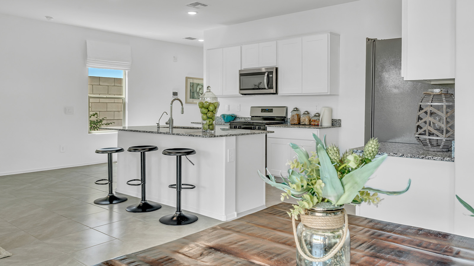 Introducing The Kate at Blackhawk in Tucson, Arizona – a spacious 2,264 sq. ft. two-story new home designed to offer both comfort and modern living in a prime location.  As you step through the inviting front porch, you’re welcomed into a thoughtfully designed entryway that leads directly into the heart of the home. The main floor boasts a generous great room that seamlessly connects to the dining area and kitchen, creating an ideal space for entertaining and everyday living. The kitchen is equipped with sleek granite countertops, a large island with a breakfast bar, modern appliances, and a pantry that provides ample storage, ensuring that the kitchen is both functional and stylish.  The main level also features a convenient powder room, perfect for guests, and direct access to the two-car garage, enhancing the home’s practicality.  Heading upstairs, you’ll discover the family’s private quarters. The master suite offers a serene retreat, complete with a spacious bedroom, a large walk-in closet, and an en-suite bathroom featuring dual vanities and a walk-in shower. The upper level also includes three additional bedrooms, a full bathroom, and a utility room centrally located for easy access. Additionally, a versatile loft area provides extra space that can be tailored to fit your lifestyle, whether as a game room, home office, or a second living area.  Step outside from the great room to the covered patio, where you can enjoy Tucson’s beautiful weather year-round. Whether you’re hosting an outdoor gathering or simply relaxing after a long day, this space extends your living area and enhances the home’s inviting ambiance.  Designed with energy efficiency in mind, The Kate at Blackhawk is a DOE Zero Energy Ready Home, combining sustainability, comfort, and long-term savings.