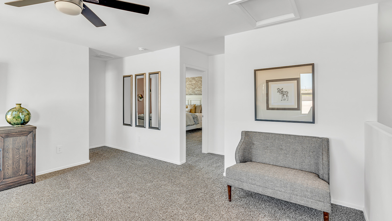 Introducing The Kate at Blackhawk in Tucson, Arizona – a spacious 2,264 sq. ft. two-story new home designed to offer both comfort and modern living in a prime location.  As you step through the inviting front porch, you’re welcomed into a thoughtfully designed entryway that leads directly into the heart of the home. The main floor boasts a generous great room that seamlessly connects to the dining area and kitchen, creating an ideal space for entertaining and everyday living. The kitchen is equipped with sleek granite countertops, a large island with a breakfast bar, modern appliances, and a pantry that provides ample storage, ensuring that the kitchen is both functional and stylish.  The main level also features a convenient powder room, perfect for guests, and direct access to the two-car garage, enhancing the home’s practicality.  Heading upstairs, you’ll discover the family’s private quarters. The master suite offers a serene retreat, complete with a spacious bedroom, a large walk-in closet, and an en-suite bathroom featuring dual vanities and a walk-in shower. The upper level also includes three additional bedrooms, a full bathroom, and a utility room centrally located for easy access. Additionally, a versatile loft area provides extra space that can be tailored to fit your lifestyle, whether as a game room, home office, or a second living area.  Step outside from the great room to the covered patio, where you can enjoy Tucson’s beautiful weather year-round. Whether you’re hosting an outdoor gathering or simply relaxing after a long day, this space extends your living area and enhances the home’s inviting ambiance.  Designed with energy efficiency in mind, The Kate at Blackhawk is a DOE Zero Energy Ready Home, combining sustainability, comfort, and long-term savings.