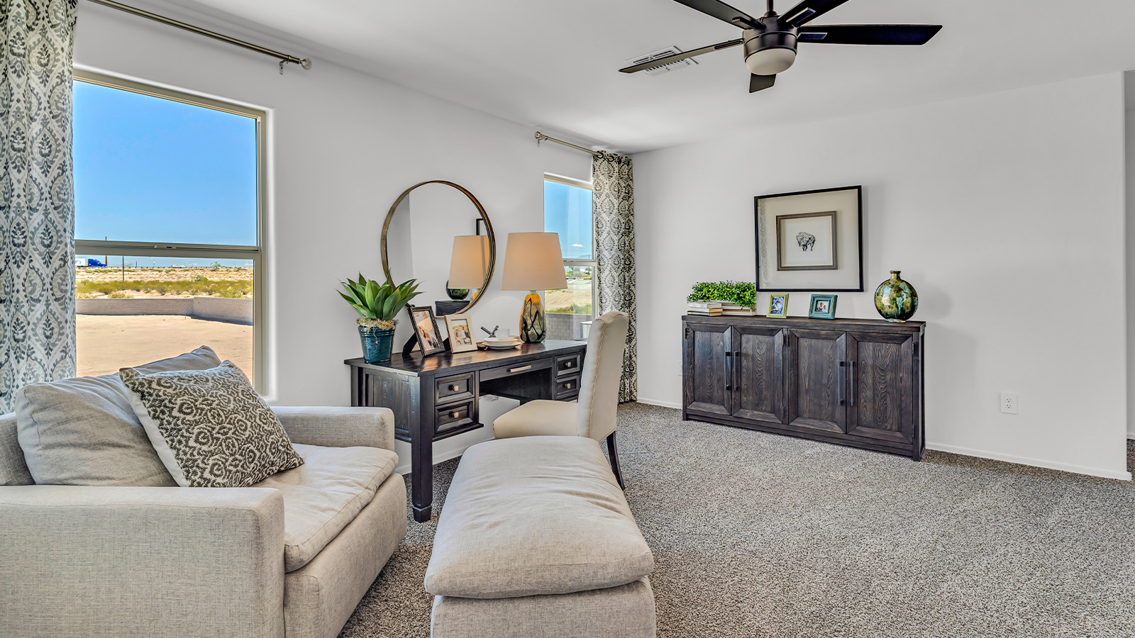 Introducing The Kate at Blackhawk in Tucson, Arizona – a spacious 2,264 sq. ft. two-story new home designed to offer both comfort and modern living in a prime location.  As you step through the inviting front porch, you’re welcomed into a thoughtfully designed entryway that leads directly into the heart of the home. The main floor boasts a generous great room that seamlessly connects to the dining area and kitchen, creating an ideal space for entertaining and everyday living. The kitchen is equipped with sleek granite countertops, a large island with a breakfast bar, modern appliances, and a pantry that provides ample storage, ensuring that the kitchen is both functional and stylish.  The main level also features a convenient powder room, perfect for guests, and direct access to the two-car garage, enhancing the home’s practicality.  Heading upstairs, you’ll discover the family’s private quarters. The master suite offers a serene retreat, complete with a spacious bedroom, a large walk-in closet, and an en-suite bathroom featuring dual vanities and a walk-in shower. The upper level also includes three additional bedrooms, a full bathroom, and a utility room centrally located for easy access. Additionally, a versatile loft area provides extra space that can be tailored to fit your lifestyle, whether as a game room, home office, or a second living area.  Step outside from the great room to the covered patio, where you can enjoy Tucson’s beautiful weather year-round. Whether you’re hosting an outdoor gathering or simply relaxing after a long day, this space extends your living area and enhances the home’s inviting ambiance.  Designed with energy efficiency in mind, The Kate at Blackhawk is a DOE Zero Energy Ready Home, combining sustainability, comfort, and long-term savings.