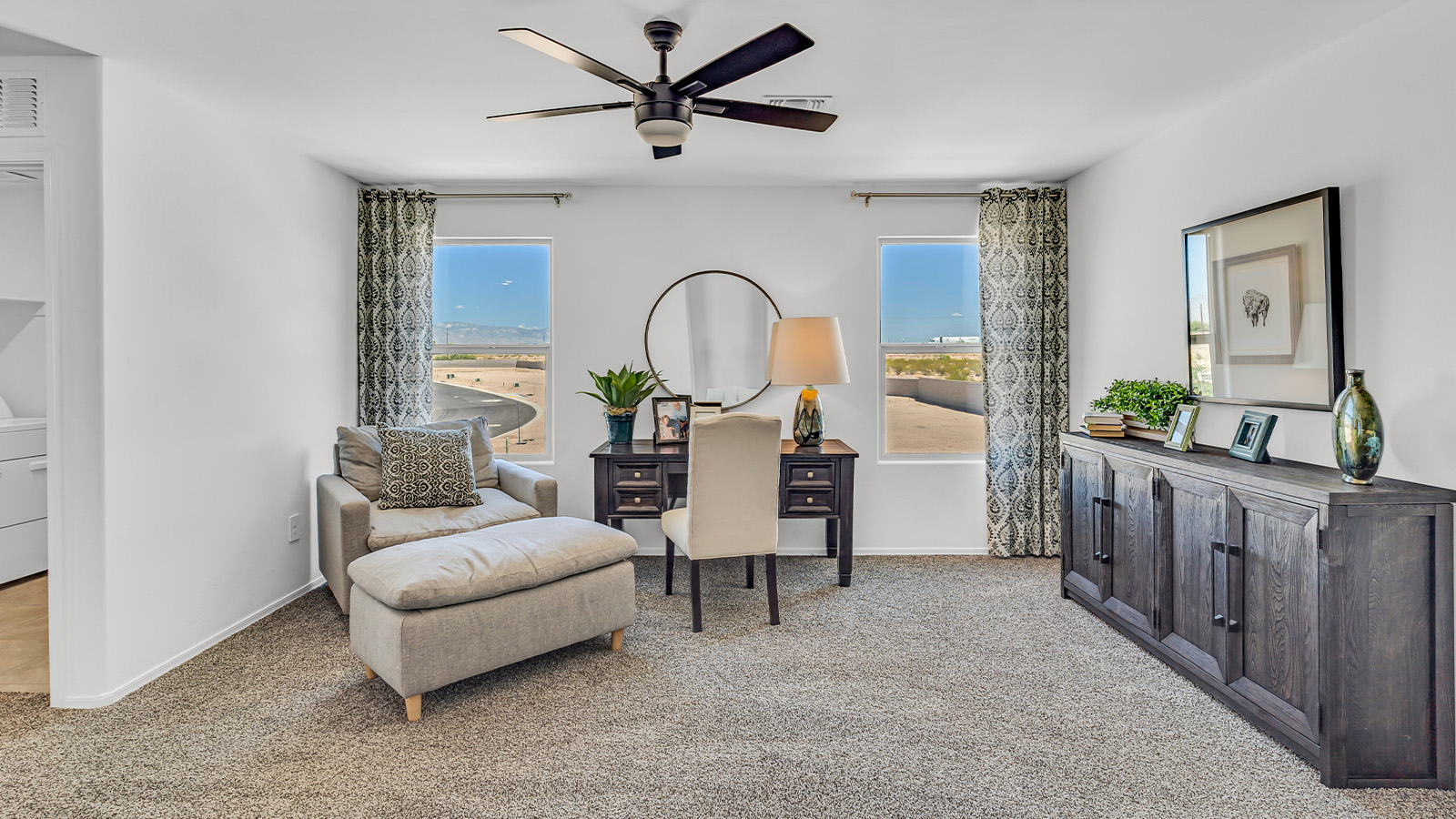 Introducing The Kate at Blackhawk in Tucson, Arizona – a spacious 2,264 sq. ft. two-story new home designed to offer both comfort and modern living in a prime location.  As you step through the inviting front porch, you’re welcomed into a thoughtfully designed entryway that leads directly into the heart of the home. The main floor boasts a generous great room that seamlessly connects to the dining area and kitchen, creating an ideal space for entertaining and everyday living. The kitchen is equipped with sleek granite countertops, a large island with a breakfast bar, modern appliances, and a pantry that provides ample storage, ensuring that the kitchen is both functional and stylish.  The main level also features a convenient powder room, perfect for guests, and direct access to the two-car garage, enhancing the home’s practicality.  Heading upstairs, you’ll discover the family’s private quarters. The master suite offers a serene retreat, complete with a spacious bedroom, a large walk-in closet, and an en-suite bathroom featuring dual vanities and a walk-in shower. The upper level also includes three additional bedrooms, a full bathroom, and a utility room centrally located for easy access. Additionally, a versatile loft area provides extra space that can be tailored to fit your lifestyle, whether as a game room, home office, or a second living area.  Step outside from the great room to the covered patio, where you can enjoy Tucson’s beautiful weather year-round. Whether you’re hosting an outdoor gathering or simply relaxing after a long day, this space extends your living area and enhances the home’s inviting ambiance.  Designed with energy efficiency in mind, The Kate at Blackhawk is a DOE Zero Energy Ready Home, combining sustainability, comfort, and long-term savings.