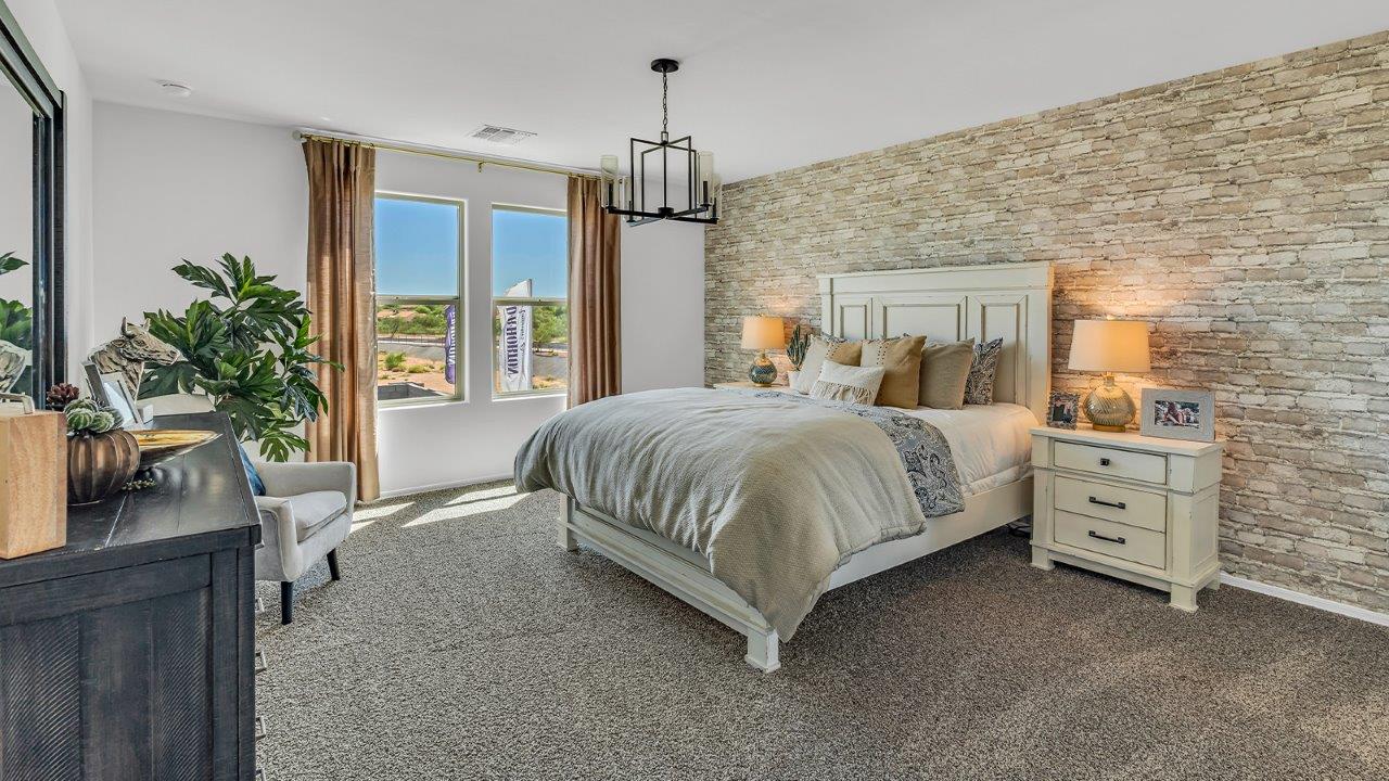 Introducing The Kate at Blackhawk in Tucson, Arizona – a spacious 2,264 sq. ft. two-story new home designed to offer both comfort and modern living in a prime location.  As you step through the inviting front porch, you’re welcomed into a thoughtfully designed entryway that leads directly into the heart of the home. The main floor boasts a generous great room that seamlessly connects to the dining area and kitchen, creating an ideal space for entertaining and everyday living. The kitchen is equipped with sleek granite countertops, a large island with a breakfast bar, modern appliances, and a pantry that provides ample storage, ensuring that the kitchen is both functional and stylish.  The main level also features a convenient powder room, perfect for guests, and direct access to the two-car garage, enhancing the home’s practicality.  Heading upstairs, you’ll discover the family’s private quarters. The master suite offers a serene retreat, complete with a spacious bedroom, a large walk-in closet, and an en-suite bathroom featuring dual vanities and a walk-in shower. The upper level also includes three additional bedrooms, a full bathroom, and a utility room centrally located for easy access. Additionally, a versatile loft area provides extra space that can be tailored to fit your lifestyle, whether as a game room, home office, or a second living area.  Step outside from the great room to the covered patio, where you can enjoy Tucson’s beautiful weather year-round. Whether you’re hosting an outdoor gathering or simply relaxing after a long day, this space extends your living area and enhances the home’s inviting ambiance.  Designed with energy efficiency in mind, The Kate at Blackhawk is a DOE Zero Energy Ready Home, combining sustainability, comfort, and long-term savings.