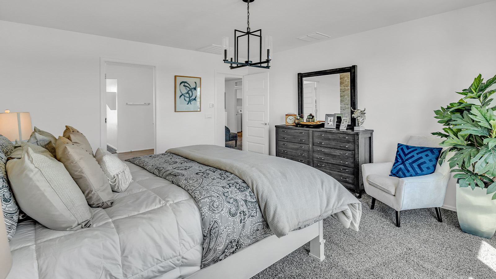 Introducing The Kate at Blackhawk in Tucson, Arizona – a spacious 2,264 sq. ft. two-story new home designed to offer both comfort and modern living in a prime location.  As you step through the inviting front porch, you’re welcomed into a thoughtfully designed entryway that leads directly into the heart of the home. The main floor boasts a generous great room that seamlessly connects to the dining area and kitchen, creating an ideal space for entertaining and everyday living. The kitchen is equipped with sleek granite countertops, a large island with a breakfast bar, modern appliances, and a pantry that provides ample storage, ensuring that the kitchen is both functional and stylish.  The main level also features a convenient powder room, perfect for guests, and direct access to the two-car garage, enhancing the home’s practicality.  Heading upstairs, you’ll discover the family’s private quarters. The master suite offers a serene retreat, complete with a spacious bedroom, a large walk-in closet, and an en-suite bathroom featuring dual vanities and a walk-in shower. The upper level also includes three additional bedrooms, a full bathroom, and a utility room centrally located for easy access. Additionally, a versatile loft area provides extra space that can be tailored to fit your lifestyle, whether as a game room, home office, or a second living area.  Step outside from the great room to the covered patio, where you can enjoy Tucson’s beautiful weather year-round. Whether you’re hosting an outdoor gathering or simply relaxing after a long day, this space extends your living area and enhances the home’s inviting ambiance.  Designed with energy efficiency in mind, The Kate at Blackhawk is a DOE Zero Energy Ready Home, combining sustainability, comfort, and long-term savings.