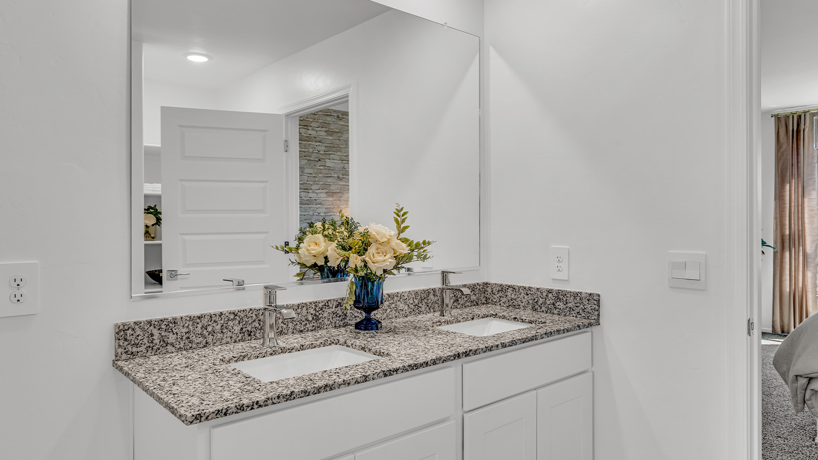 Introducing The Kate at Blackhawk in Tucson, Arizona – a spacious 2,264 sq. ft. two-story new home designed to offer both comfort and modern living in a prime location.  As you step through the inviting front porch, you’re welcomed into a thoughtfully designed entryway that leads directly into the heart of the home. The main floor boasts a generous great room that seamlessly connects to the dining area and kitchen, creating an ideal space for entertaining and everyday living. The kitchen is equipped with sleek granite countertops, a large island with a breakfast bar, modern appliances, and a pantry that provides ample storage, ensuring that the kitchen is both functional and stylish.  The main level also features a convenient powder room, perfect for guests, and direct access to the two-car garage, enhancing the home’s practicality.  Heading upstairs, you’ll discover the family’s private quarters. The master suite offers a serene retreat, complete with a spacious bedroom, a large walk-in closet, and an en-suite bathroom featuring dual vanities and a walk-in shower. The upper level also includes three additional bedrooms, a full bathroom, and a utility room centrally located for easy access. Additionally, a versatile loft area provides extra space that can be tailored to fit your lifestyle, whether as a game room, home office, or a second living area.  Step outside from the great room to the covered patio, where you can enjoy Tucson’s beautiful weather year-round. Whether you’re hosting an outdoor gathering or simply relaxing after a long day, this space extends your living area and enhances the home’s inviting ambiance.  Designed with energy efficiency in mind, The Kate at Blackhawk is a DOE Zero Energy Ready Home, combining sustainability, comfort, and long-term savings.