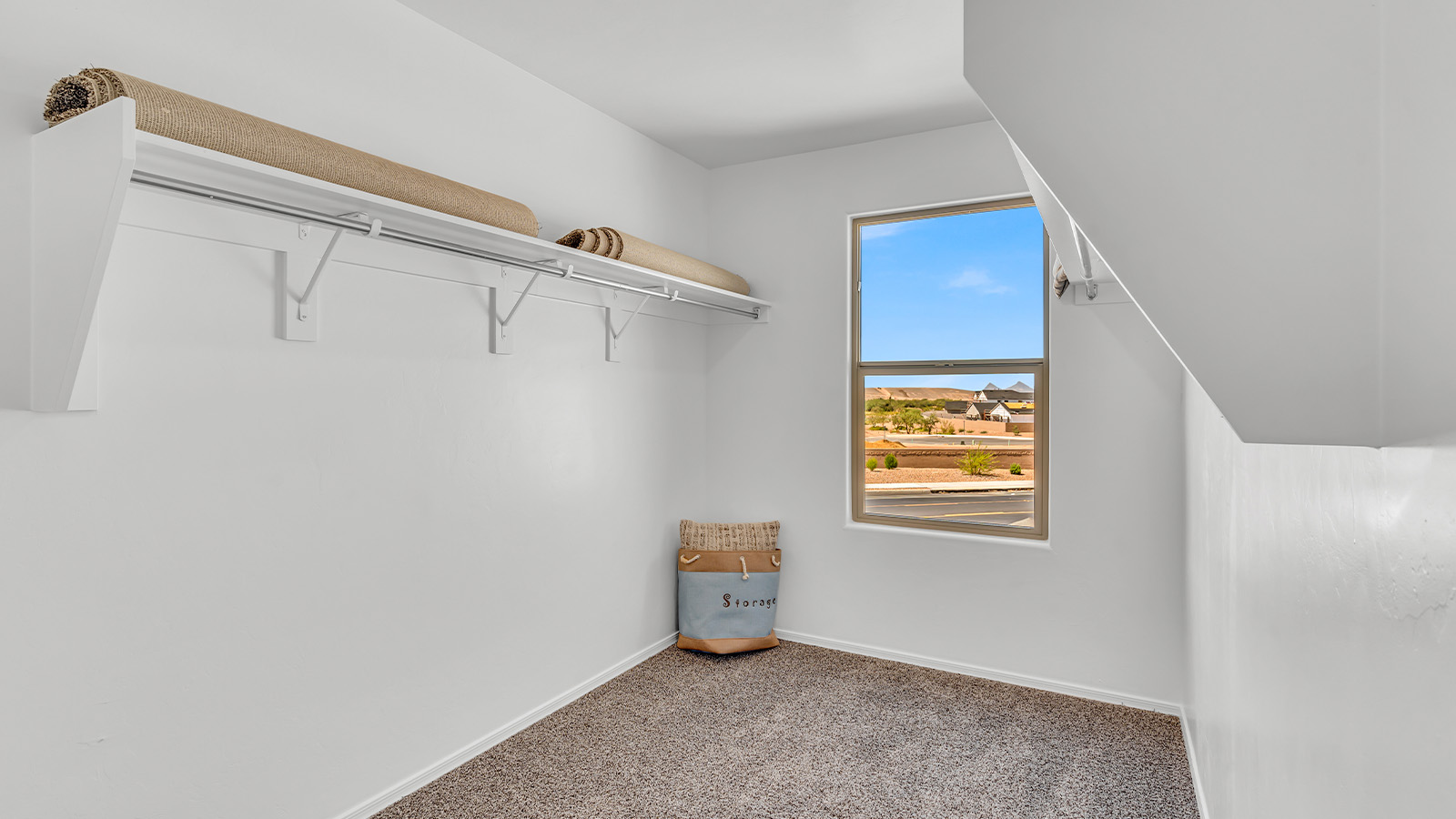 Introducing The Kate at Blackhawk in Tucson, Arizona – a spacious 2,264 sq. ft. two-story new home designed to offer both comfort and modern living in a prime location.  As you step through the inviting front porch, you’re welcomed into a thoughtfully designed entryway that leads directly into the heart of the home. The main floor boasts a generous great room that seamlessly connects to the dining area and kitchen, creating an ideal space for entertaining and everyday living. The kitchen is equipped with sleek granite countertops, a large island with a breakfast bar, modern appliances, and a pantry that provides ample storage, ensuring that the kitchen is both functional and stylish.  The main level also features a convenient powder room, perfect for guests, and direct access to the two-car garage, enhancing the home’s practicality.  Heading upstairs, you’ll discover the family’s private quarters. The master suite offers a serene retreat, complete with a spacious bedroom, a large walk-in closet, and an en-suite bathroom featuring dual vanities and a walk-in shower. The upper level also includes three additional bedrooms, a full bathroom, and a utility room centrally located for easy access. Additionally, a versatile loft area provides extra space that can be tailored to fit your lifestyle, whether as a game room, home office, or a second living area.  Step outside from the great room to the covered patio, where you can enjoy Tucson’s beautiful weather year-round. Whether you’re hosting an outdoor gathering or simply relaxing after a long day, this space extends your living area and enhances the home’s inviting ambiance.  Designed with energy efficiency in mind, The Kate at Blackhawk is a DOE Zero Energy Ready Home, combining sustainability, comfort, and long-term savings.