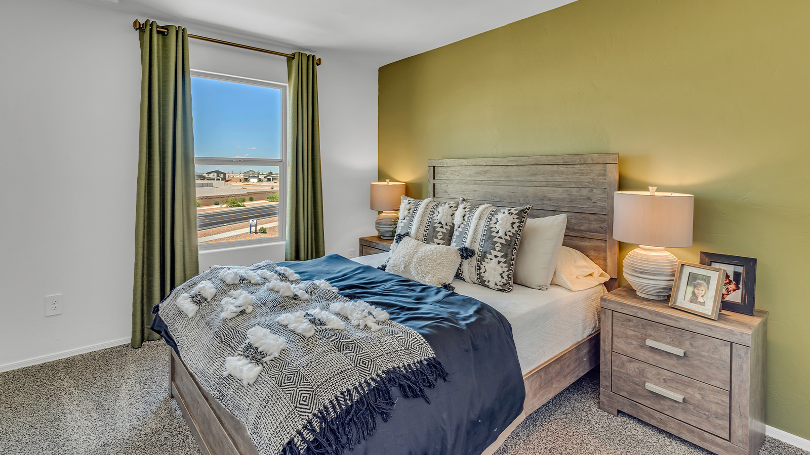 Introducing The Kate at Blackhawk in Tucson, Arizona – a spacious 2,264 sq. ft. two-story new home designed to offer both comfort and modern living in a prime location.  As you step through the inviting front porch, you’re welcomed into a thoughtfully designed entryway that leads directly into the heart of the home. The main floor boasts a generous great room that seamlessly connects to the dining area and kitchen, creating an ideal space for entertaining and everyday living. The kitchen is equipped with sleek granite countertops, a large island with a breakfast bar, modern appliances, and a pantry that provides ample storage, ensuring that the kitchen is both functional and stylish.  The main level also features a convenient powder room, perfect for guests, and direct access to the two-car garage, enhancing the home’s practicality.  Heading upstairs, you’ll discover the family’s private quarters. The master suite offers a serene retreat, complete with a spacious bedroom, a large walk-in closet, and an en-suite bathroom featuring dual vanities and a walk-in shower. The upper level also includes three additional bedrooms, a full bathroom, and a utility room centrally located for easy access. Additionally, a versatile loft area provides extra space that can be tailored to fit your lifestyle, whether as a game room, home office, or a second living area.  Step outside from the great room to the covered patio, where you can enjoy Tucson’s beautiful weather year-round. Whether you’re hosting an outdoor gathering or simply relaxing after a long day, this space extends your living area and enhances the home’s inviting ambiance.  Designed with energy efficiency in mind, The Kate at Blackhawk is a DOE Zero Energy Ready Home, combining sustainability, comfort, and long-term savings.