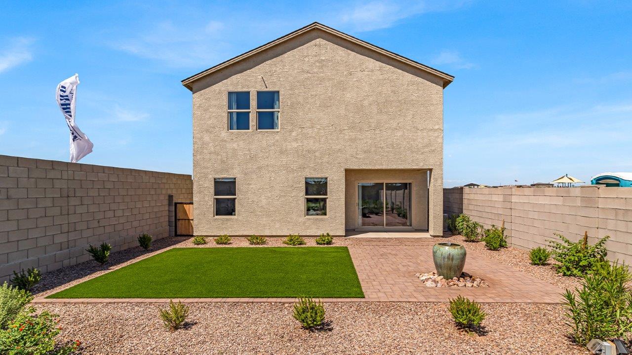Introducing The Kate at Blackhawk in Tucson, Arizona – a spacious 2,264 sq. ft. two-story new home designed to offer both comfort and modern living in a prime location.  As you step through the inviting front porch, you’re welcomed into a thoughtfully designed entryway that leads directly into the heart of the home. The main floor boasts a generous great room that seamlessly connects to the dining area and kitchen, creating an ideal space for entertaining and everyday living. The kitchen is equipped with sleek granite countertops, a large island with a breakfast bar, modern appliances, and a pantry that provides ample storage, ensuring that the kitchen is both functional and stylish.  The main level also features a convenient powder room, perfect for guests, and direct access to the two-car garage, enhancing the home’s practicality.  Heading upstairs, you’ll discover the family’s private quarters. The master suite offers a serene retreat, complete with a spacious bedroom, a large walk-in closet, and an en-suite bathroom featuring dual vanities and a walk-in shower. The upper level also includes three additional bedrooms, a full bathroom, and a utility room centrally located for easy access. Additionally, a versatile loft area provides extra space that can be tailored to fit your lifestyle, whether as a game room, home office, or a second living area.  Step outside from the great room to the covered patio, where you can enjoy Tucson’s beautiful weather year-round. Whether you’re hosting an outdoor gathering or simply relaxing after a long day, this space extends your living area and enhances the home’s inviting ambiance.  Designed with energy efficiency in mind, The Kate at Blackhawk is a DOE Zero Energy Ready Home, combining sustainability, comfort, and long-term savings.