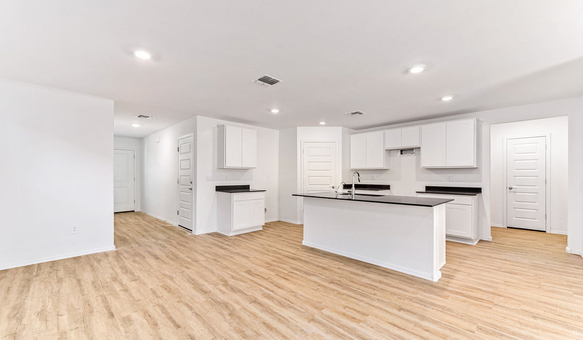 Welcome to The Madison at Blackhawk in Tucson, Arizona – the largest home in the community, offering an expansive 2,522 sq. ft. of living space designed for families seeking both luxury and functionality.  As you step through the inviting front porch, you're greeted by a thoughtfully designed entryway that leads into the heart of the home. The main level features a spacious great room that flows effortlessly into the dining area and the kitchen, making it an ideal space for entertaining and family gatherings. The kitchen is equipped with elegant granite countertops, a large island with a breakfast bar, modern appliances, and a pantry that provides ample storage, ensuring that the kitchen is as functional as it is stylish.  The main floor also includes a bedroom with easy access to a full bathroom, making it a perfect guest suite or a private home office. The convenient bathroom and direct access to the two-car garage enhance the home’s functionality, while the nearby utility room adds a layer of practicality to daily living.  Heading upstairs, you’ll find the family’s private quarters. The master suite is a true retreat, featuring a generously sized bedroom, a large walk-in closet, and an en-suite bathroom complete with dual vanities and a walk-in shower. The upper level also includes three additional bedrooms, a full bathroom, and a versatile loft area that can be tailored to fit your lifestyle, whether as a playroom, home office, or additional living space.  Back downstairs, step outside from the great room to the covered patio, where you can enjoy Tucson’s stunning weather year-round. Whether you’re hosting an outdoor gathering or simply relaxing after a long day, this space extends your living area and enhances the home’s inviting ambiance.  Designed with energy efficiency in mind, The Madison at Blackhawk is a DOE Zero Energy Ready Home, ensuring sustainability, comfort, and long-term savings.  Images shown are for reference only. They depict the Madison model home and may not represent the actual home.