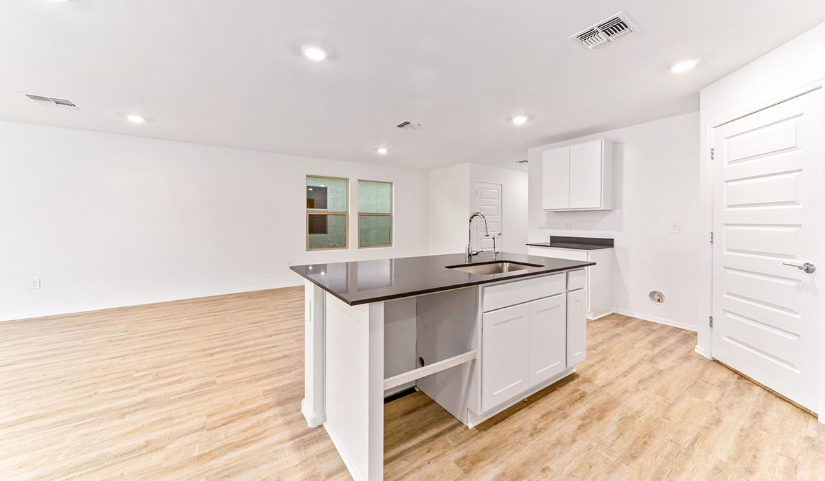 Welcome to The Madison at Blackhawk in Tucson, Arizona – the largest home in the community, offering an expansive 2,522 sq. ft. of living space designed for families seeking both luxury and functionality.  As you step through the inviting front porch, you're greeted by a thoughtfully designed entryway that leads into the heart of the home. The main level features a spacious great room that flows effortlessly into the dining area and the kitchen, making it an ideal space for entertaining and family gatherings. The kitchen is equipped with elegant granite countertops, a large island with a breakfast bar, modern appliances, and a pantry that provides ample storage, ensuring that the kitchen is as functional as it is stylish.  The main floor also includes a bedroom with easy access to a full bathroom, making it a perfect guest suite or a private home office. The convenient bathroom and direct access to the two-car garage enhance the home’s functionality, while the nearby utility room adds a layer of practicality to daily living.  Heading upstairs, you’ll find the family’s private quarters. The master suite is a true retreat, featuring a generously sized bedroom, a large walk-in closet, and an en-suite bathroom complete with dual vanities and a walk-in shower. The upper level also includes three additional bedrooms, a full bathroom, and a versatile loft area that can be tailored to fit your lifestyle, whether as a playroom, home office, or additional living space.  Back downstairs, step outside from the great room to the covered patio, where you can enjoy Tucson’s stunning weather year-round. Whether you’re hosting an outdoor gathering or simply relaxing after a long day, this space extends your living area and enhances the home’s inviting ambiance.  Designed with energy efficiency in mind, The Madison at Blackhawk is a DOE Zero Energy Ready Home, ensuring sustainability, comfort, and long-term savings.  Images shown are for reference only. They depict the Madison model home and may not represent the actual home.