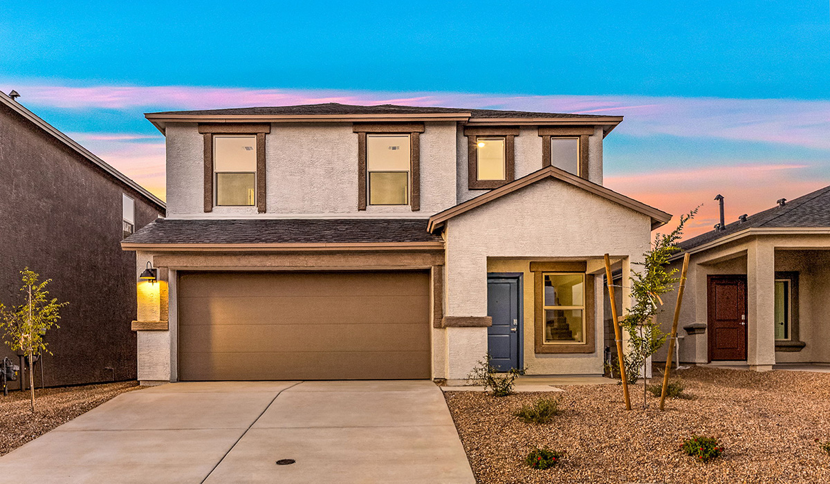 Welcome to The Madison at Blackhawk in Tucson, Arizona – the largest home in the community, offering an expansive 2,522 sq. ft. of living space designed for families seeking both luxury and functionality.  As you step through the inviting front porch, you're greeted by a thoughtfully designed entryway that leads into the heart of the home. The main level features a spacious great room that flows effortlessly into the dining area and the kitchen, making it an ideal space for entertaining and family gatherings. The kitchen is equipped with elegant granite countertops, a large island with a breakfast bar, modern appliances, and a pantry that provides ample storage, ensuring that the kitchen is as functional as it is stylish.  The main floor also includes a bedroom with easy access to a full bathroom, making it a perfect guest suite or a private home office. The convenient bathroom and direct access to the two-car garage enhance the home’s functionality, while the nearby utility room adds a layer of practicality to daily living.  Heading upstairs, you’ll find the family’s private quarters. The master suite is a true retreat, featuring a generously sized bedroom, a large walk-in closet, and an en-suite bathroom complete with dual vanities and a walk-in shower. The upper level also includes three additional bedrooms, a full bathroom, and a versatile loft area that can be tailored to fit your lifestyle, whether as a playroom, home office, or additional living space.  Back downstairs, step outside from the great room to the covered patio, where you can enjoy Tucson’s stunning weather year-round. Whether you’re hosting an outdoor gathering or simply relaxing after a long day, this space extends your living area and enhances the home’s inviting ambiance.  Designed with energy efficiency in mind, The Madison at Blackhawk is a DOE Zero Energy Ready Home, ensuring sustainability, comfort, and long-term savings.  Images shown are for reference only. They depict the Madison model home and may not represent the actual home.
