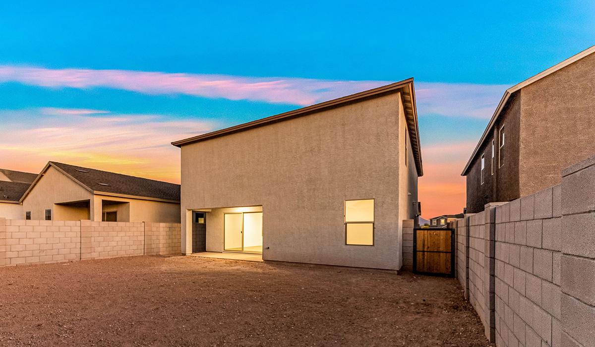 Welcome to The Madison at Blackhawk in Tucson, Arizona – the largest home in the community, offering an expansive 2,522 sq. ft. of living space designed for families seeking both luxury and functionality.  As you step through the inviting front porch, you're greeted by a thoughtfully designed entryway that leads into the heart of the home. The main level features a spacious great room that flows effortlessly into the dining area and the kitchen, making it an ideal space for entertaining and family gatherings. The kitchen is equipped with elegant granite countertops, a large island with a breakfast bar, modern appliances, and a pantry that provides ample storage, ensuring that the kitchen is as functional as it is stylish.  The main floor also includes a bedroom with easy access to a full bathroom, making it a perfect guest suite or a private home office. The convenient bathroom and direct access to the two-car garage enhance the home’s functionality, while the nearby utility room adds a layer of practicality to daily living.  Heading upstairs, you’ll find the family’s private quarters. The master suite is a true retreat, featuring a generously sized bedroom, a large walk-in closet, and an en-suite bathroom complete with dual vanities and a walk-in shower. The upper level also includes three additional bedrooms, a full bathroom, and a versatile loft area that can be tailored to fit your lifestyle, whether as a playroom, home office, or additional living space.  Back downstairs, step outside from the great room to the covered patio, where you can enjoy Tucson’s stunning weather year-round. Whether you’re hosting an outdoor gathering or simply relaxing after a long day, this space extends your living area and enhances the home’s inviting ambiance.  Designed with energy efficiency in mind, The Madison at Blackhawk is a DOE Zero Energy Ready Home, ensuring sustainability, comfort, and long-term savings.  Images shown are for reference only. They depict the Madison model home and may not represent the actual home.