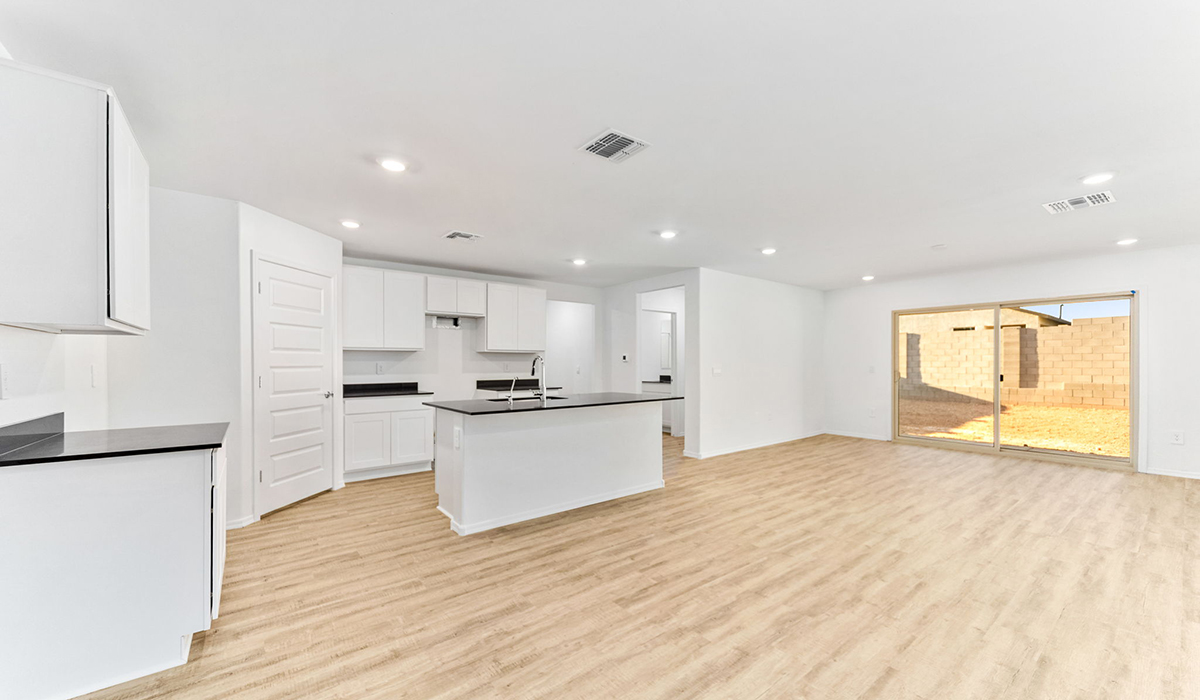 Welcome to The Madison at Blackhawk in Tucson, Arizona – the largest home in the community, offering an expansive 2,522 sq. ft. of living space designed for families seeking both luxury and functionality.  As you step through the inviting front porch, you're greeted by a thoughtfully designed entryway that leads into the heart of the home. The main level features a spacious great room that flows effortlessly into the dining area and the kitchen, making it an ideal space for entertaining and family gatherings. The kitchen is equipped with elegant granite countertops, a large island with a breakfast bar, modern appliances, and a pantry that provides ample storage, ensuring that the kitchen is as functional as it is stylish.  The main floor also includes a bedroom with easy access to a full bathroom, making it a perfect guest suite or a private home office. The convenient bathroom and direct access to the two-car garage enhance the home’s functionality, while the nearby utility room adds a layer of practicality to daily living.  Heading upstairs, you’ll find the family’s private quarters. The master suite is a true retreat, featuring a generously sized bedroom, a large walk-in closet, and an en-suite bathroom complete with dual vanities and a walk-in shower. The upper level also includes three additional bedrooms, a full bathroom, and a versatile loft area that can be tailored to fit your lifestyle, whether as a playroom, home office, or additional living space.  Back downstairs, step outside from the great room to the covered patio, where you can enjoy Tucson’s stunning weather year-round. Whether you’re hosting an outdoor gathering or simply relaxing after a long day, this space extends your living area and enhances the home’s inviting ambiance.  Designed with energy efficiency in mind, The Madison at Blackhawk is a DOE Zero Energy Ready Home, ensuring sustainability, comfort, and long-term savings.  Images shown are for reference only. They depict the Madison model home and may not represent the actual home.