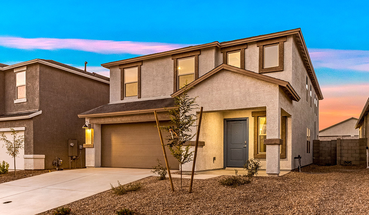 Welcome to The Madison at Blackhawk in Tucson, Arizona – the largest home in the community, offering an expansive 2,522 sq. ft. of living space designed for families seeking both luxury and functionality.  As you step through the inviting front porch, you're greeted by a thoughtfully designed entryway that leads into the heart of the home. The main level features a spacious great room that flows effortlessly into the dining area and the kitchen, making it an ideal space for entertaining and family gatherings. The kitchen is equipped with elegant granite countertops, a large island with a breakfast bar, modern appliances, and a pantry that provides ample storage, ensuring that the kitchen is as functional as it is stylish.  The main floor also includes a bedroom with easy access to a full bathroom, making it a perfect guest suite or a private home office. The convenient bathroom and direct access to the two-car garage enhance the home’s functionality, while the nearby utility room adds a layer of practicality to daily living.  Heading upstairs, you’ll find the family’s private quarters. The master suite is a true retreat, featuring a generously sized bedroom, a large walk-in closet, and an en-suite bathroom complete with dual vanities and a walk-in shower. The upper level also includes three additional bedrooms, a full bathroom, and a versatile loft area that can be tailored to fit your lifestyle, whether as a playroom, home office, or additional living space.  Back downstairs, step outside from the great room to the covered patio, where you can enjoy Tucson’s stunning weather year-round. Whether you’re hosting an outdoor gathering or simply relaxing after a long day, this space extends your living area and enhances the home’s inviting ambiance.  Designed with energy efficiency in mind, The Madison at Blackhawk is a DOE Zero Energy Ready Home, ensuring sustainability, comfort, and long-term savings.