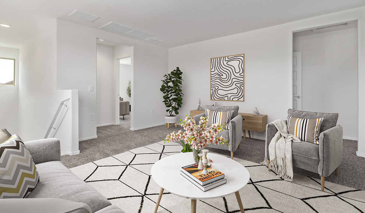 Welcome to The Madison at Blackhawk in Tucson, Arizona – the largest home in the community, offering an expansive 2,522 sq. ft. of living space designed for families seeking both luxury and functionality.  As you step through the inviting front porch, you're greeted by a thoughtfully designed entryway that leads into the heart of the home. The main level features a spacious great room that flows effortlessly into the dining area and the kitchen, making it an ideal space for entertaining and family gatherings. The kitchen is equipped with elegant granite countertops, a large island with a breakfast bar, modern appliances, and a pantry that provides ample storage, ensuring that the kitchen is as functional as it is stylish.  The main floor also includes a bedroom with easy access to a full bathroom, making it a perfect guest suite or a private home office. The convenient bathroom and direct access to the two-car garage enhance the home’s functionality, while the nearby utility room adds a layer of practicality to daily living.  Heading upstairs, you’ll find the family’s private quarters. The master suite is a true retreat, featuring a generously sized bedroom, a large walk-in closet, and an en-suite bathroom complete with dual vanities and a walk-in shower. The upper level also includes three additional bedrooms, a full bathroom, and a versatile loft area that can be tailored to fit your lifestyle, whether as a playroom, home office, or additional living space.  Back downstairs, step outside from the great room to the covered patio, where you can enjoy Tucson’s stunning weather year-round. Whether you’re hosting an outdoor gathering or simply relaxing after a long day, this space extends your living area and enhances the home’s inviting ambiance.  Designed with energy efficiency in mind, The Madison at Blackhawk is a DOE Zero Energy Ready Home, ensuring sustainability, comfort, and long-term savings.